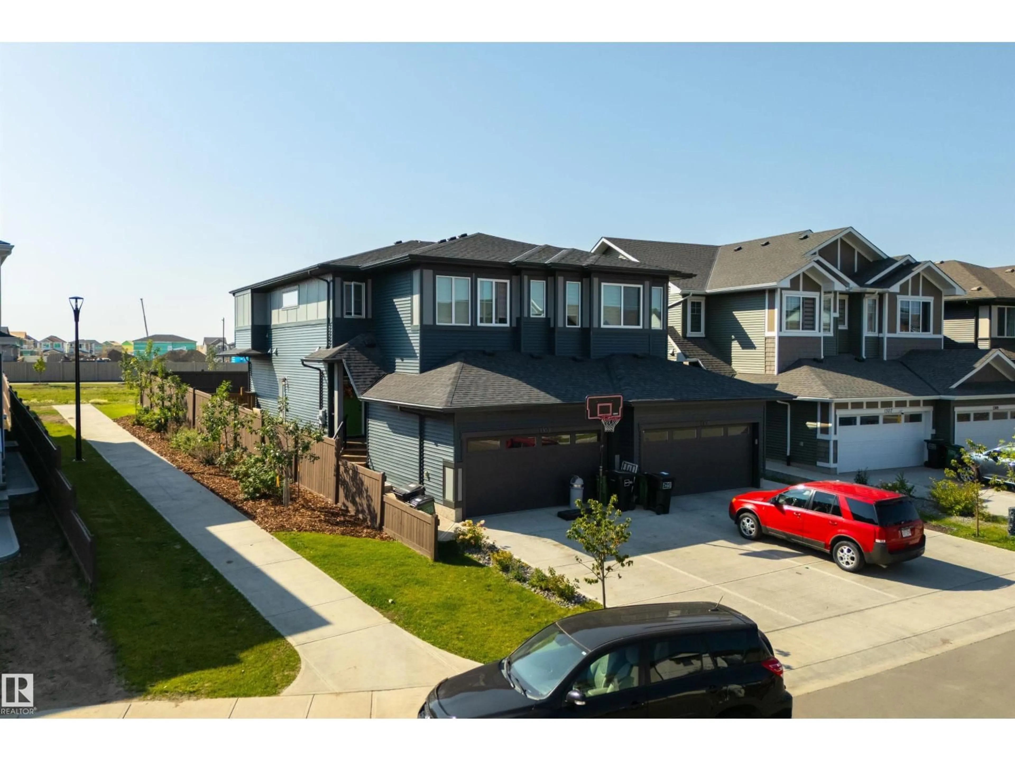A pic from outside/outdoor area/front of a property/back of a property/a pic from drone, street for SW - 1303 PODERSKY WD, Edmonton Alberta T6W5E4