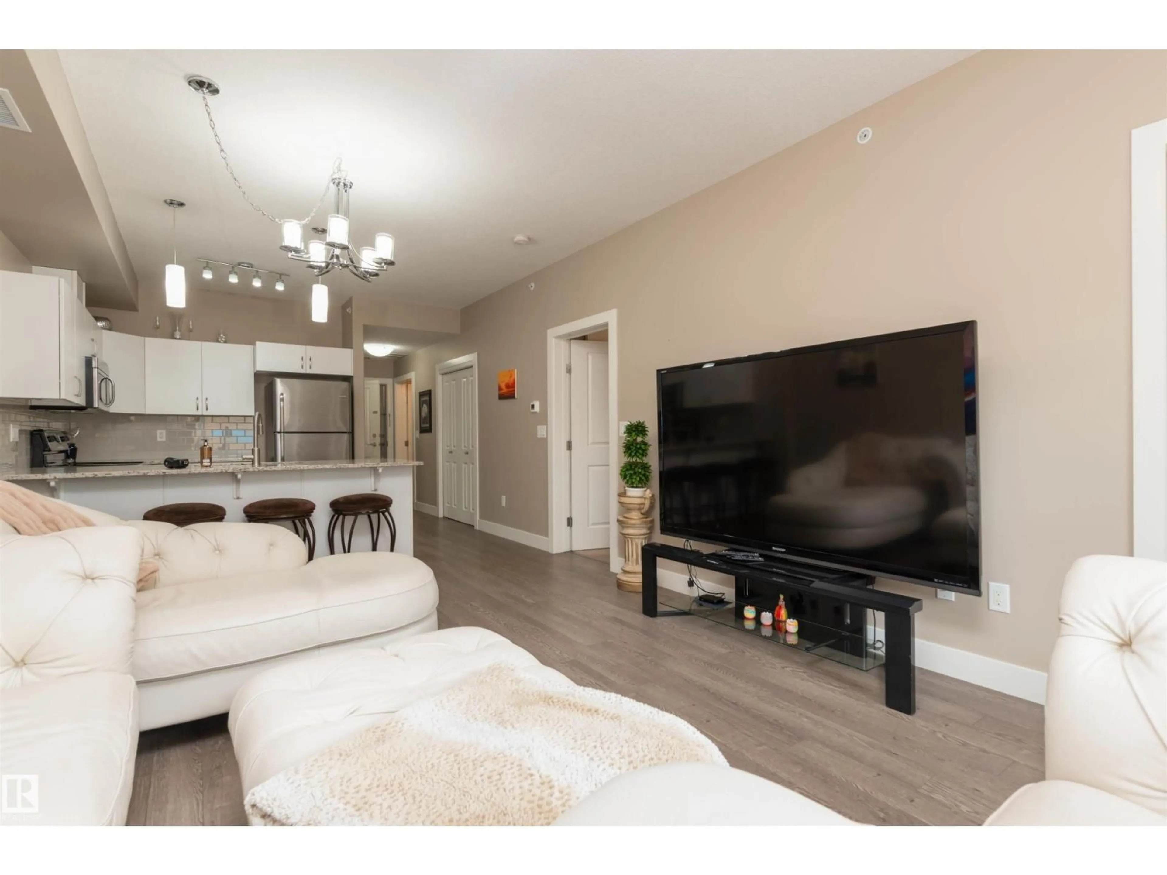 Living room with furniture, wood/laminate floor for 410 - 5001 ETON BV, Sherwood Park Alberta T8H0N7
