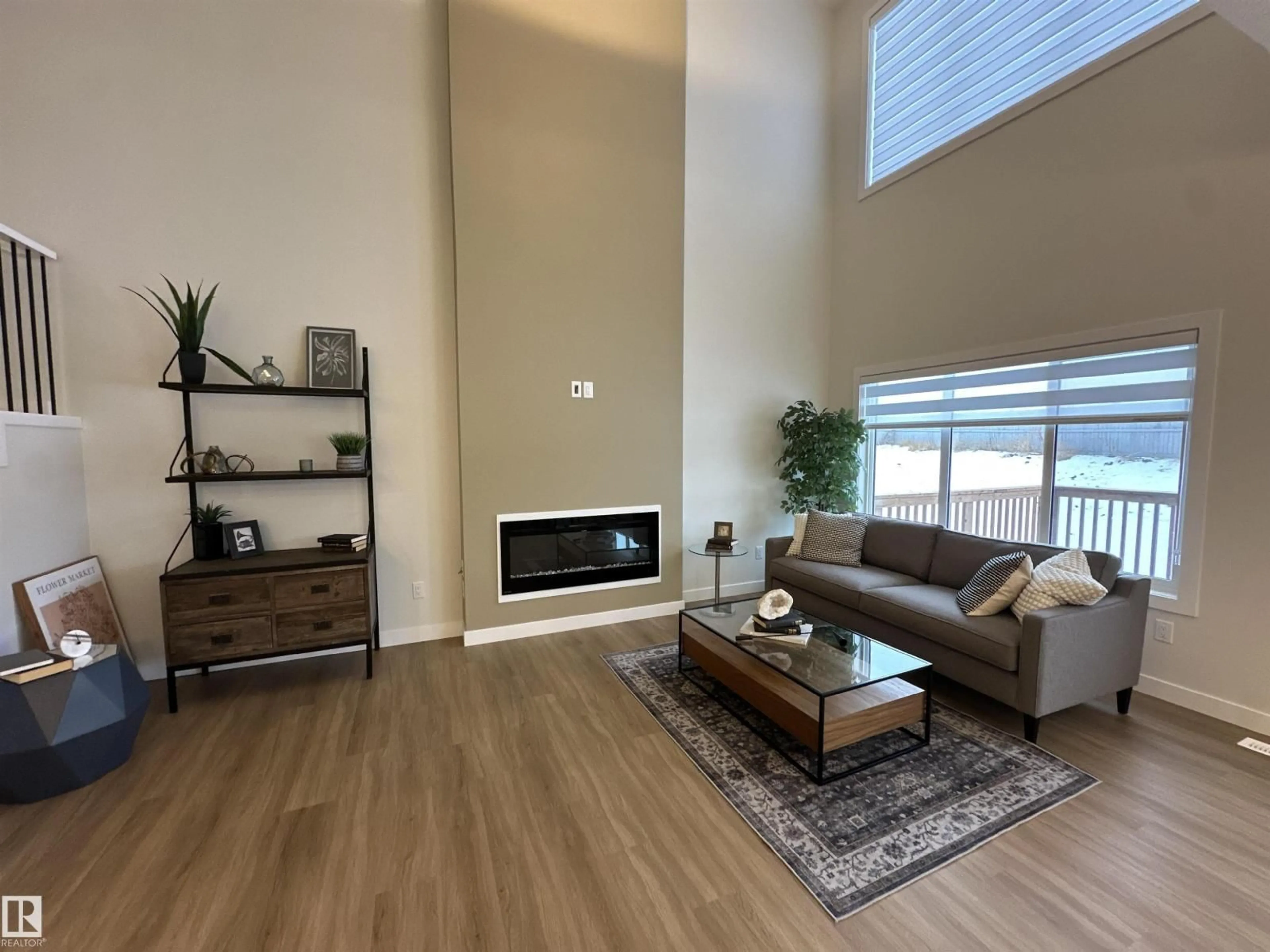 Living room with furniture, wood/laminate floor for 187 CALEDON CR, Spruce Grove Alberta T7X4E3