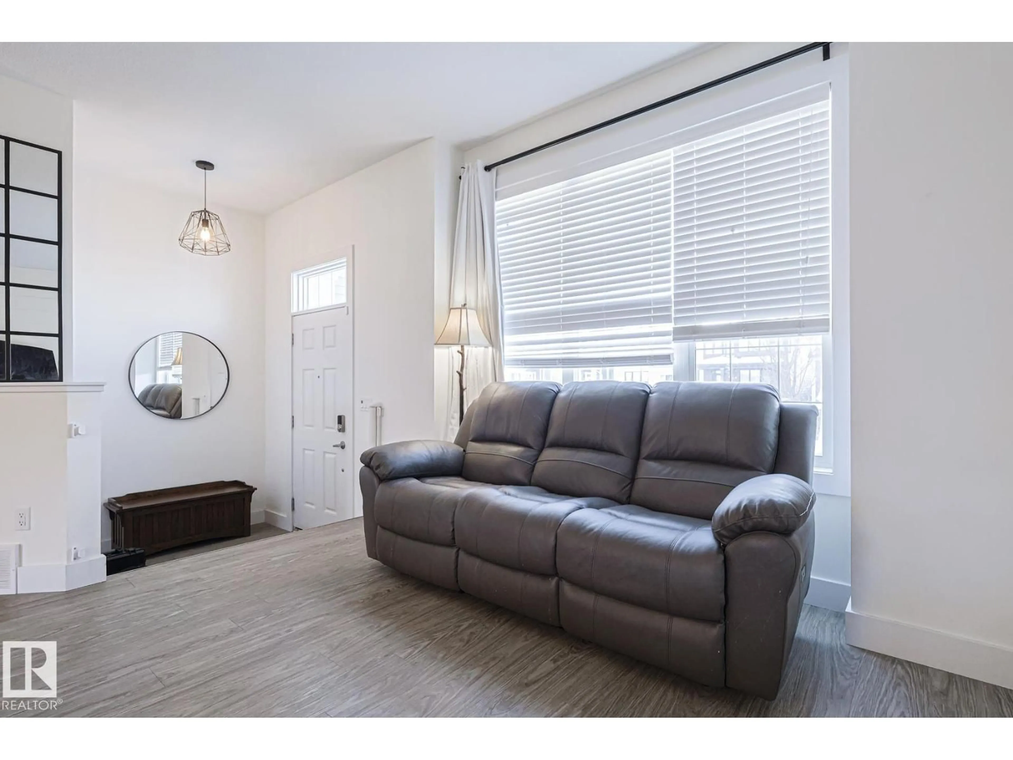 Living room with furniture, wood/laminate floor for 180 SOUTHFORK DR, Leduc Alberta T9E0Y3
