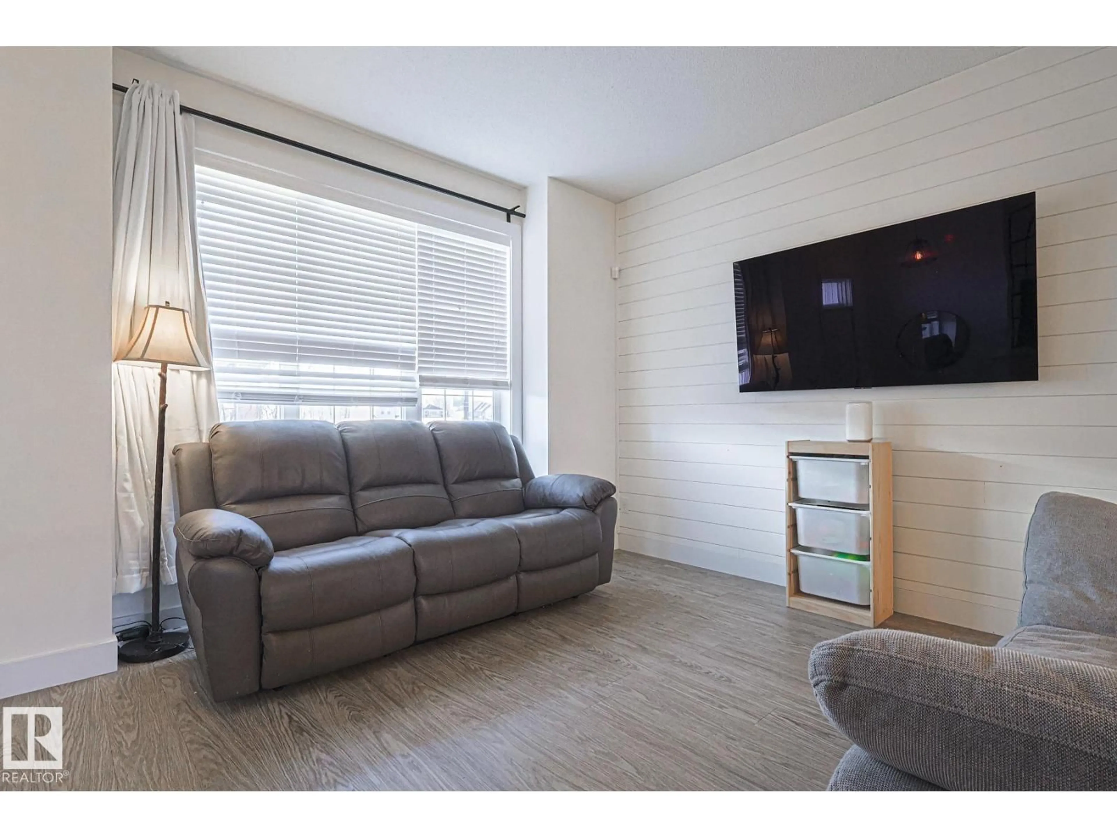 Living room with furniture, wood/laminate floor for 180 SOUTHFORK DR, Leduc Alberta T9E0Y3