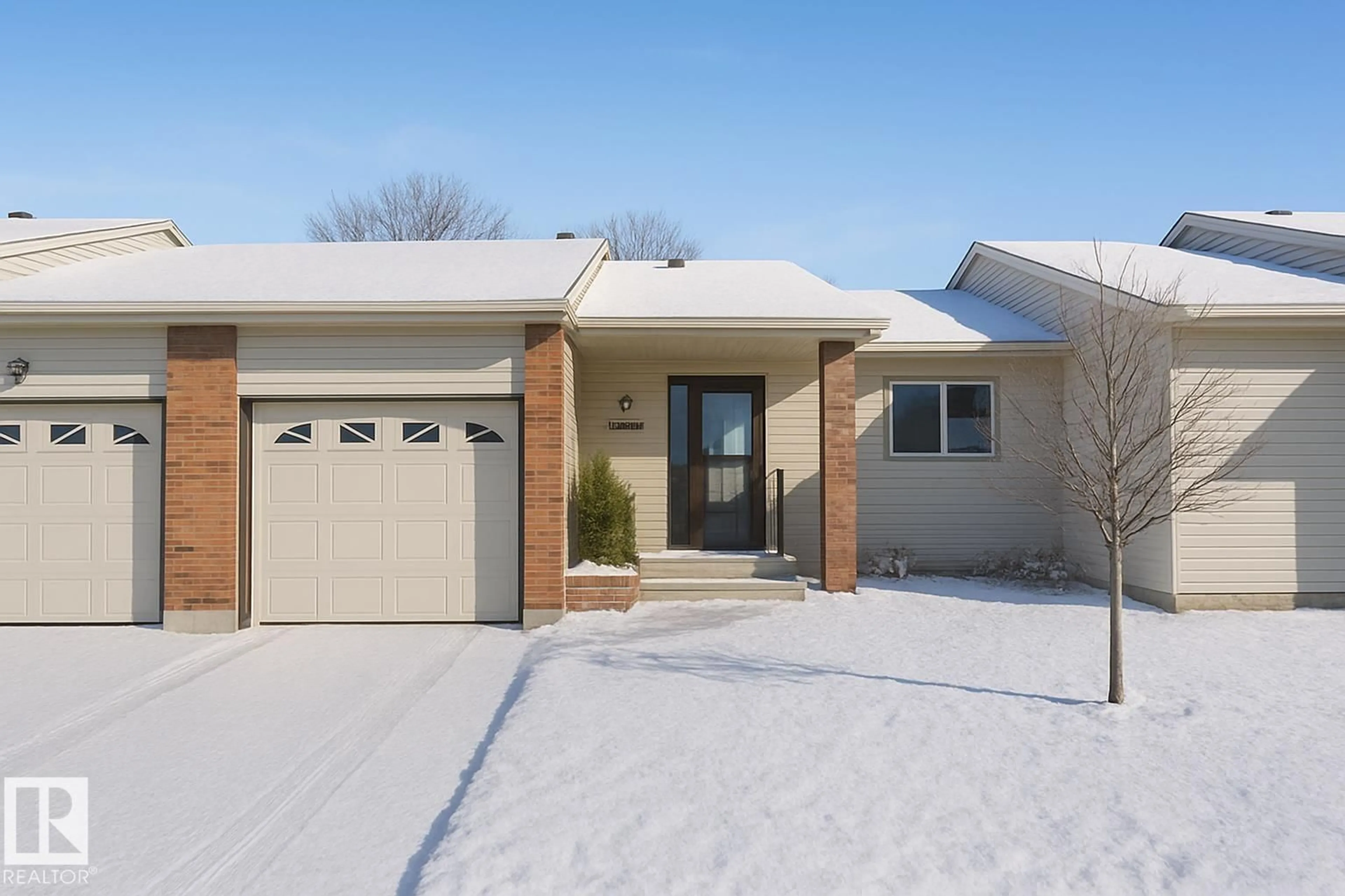 Home with brick exterior material, street for NW - 10646 153 AV, Edmonton Alberta T5X5R8