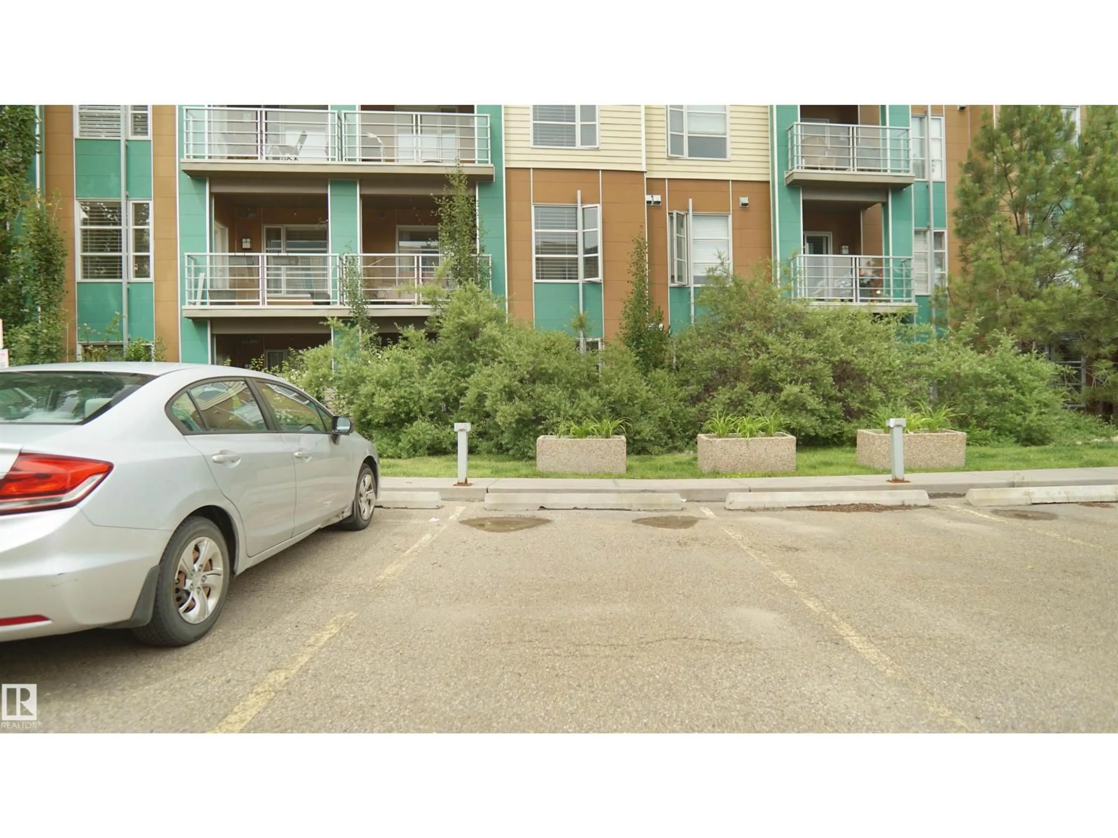 A pic from outside/outdoor area/front of a property/back of a property/a pic from drone, street for #105 - 2584 ANDERSON WY, Edmonton Alberta T6W0R2