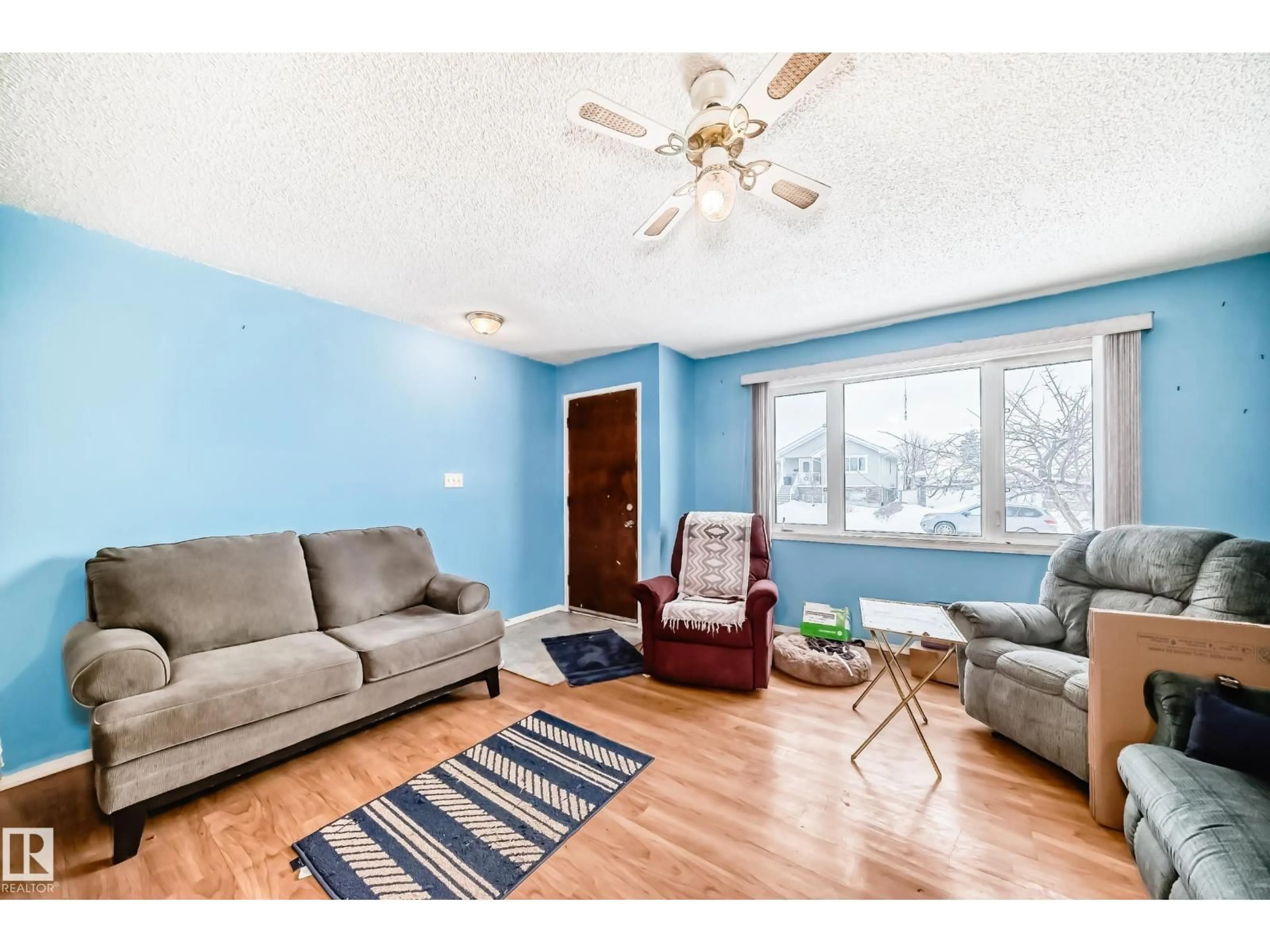 Living room with furniture, wood/laminate floor for 13444 61 ST, Edmonton Alberta T5A0T5