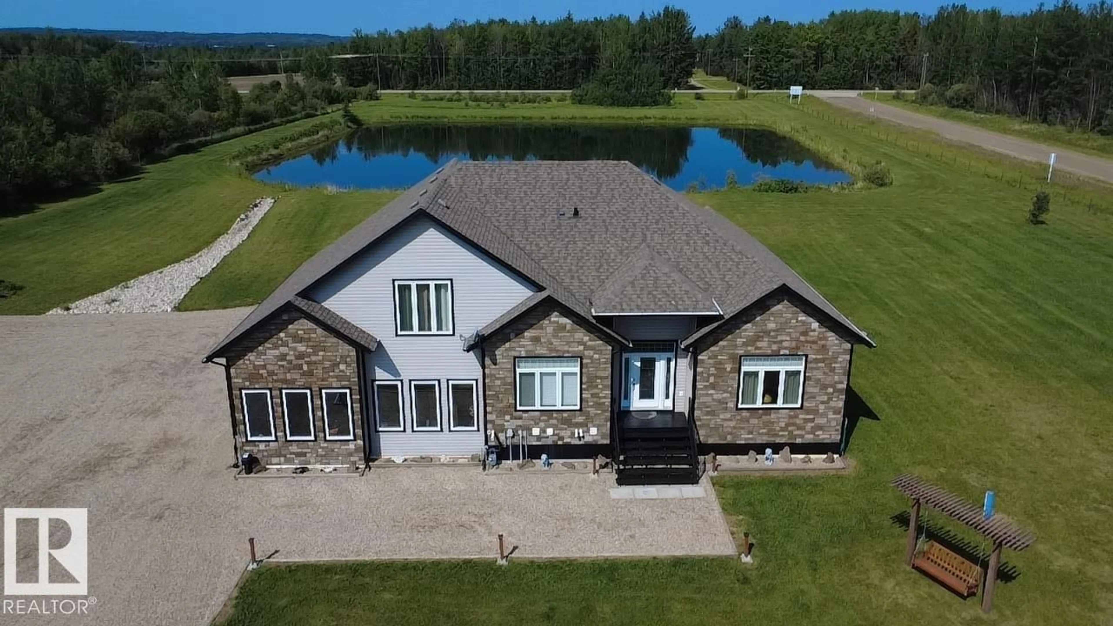 A pic from outside/outdoor area/front of a property/back of a property/a pic from drone, water/lake/river/ocean view for 49413 RGE ROAD 81, Rural Brazeau County Alberta T7A1S6