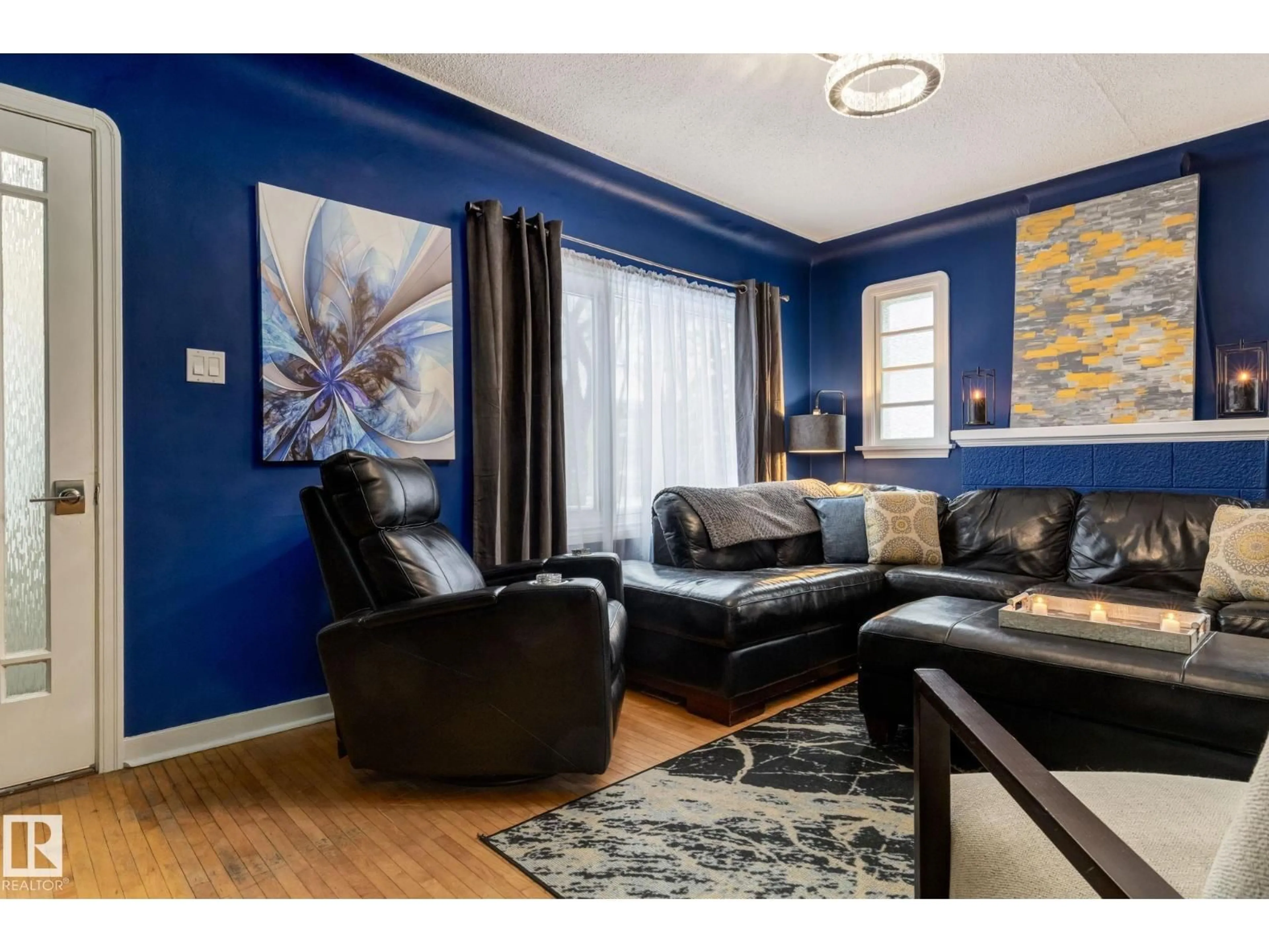 Living room with furniture, wood/laminate floor for 11844 96 ST, Edmonton Alberta T5G1V3