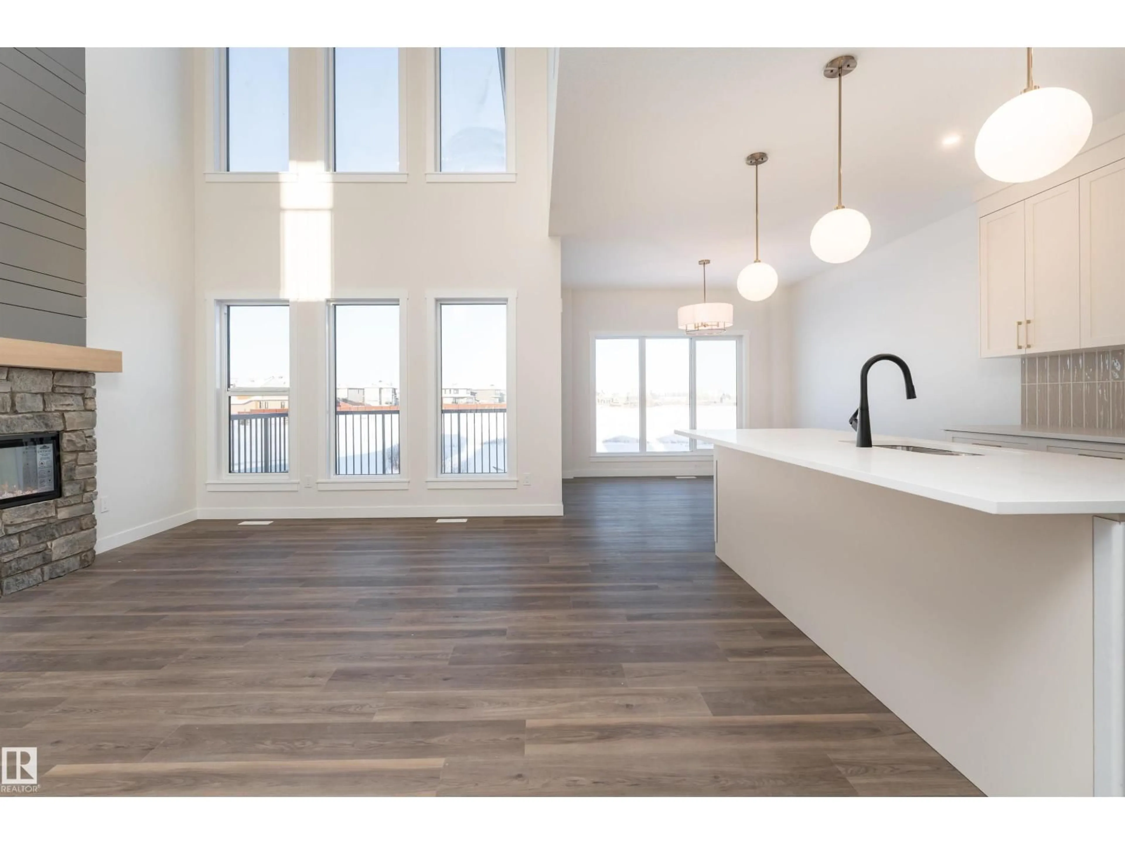 Open concept kitchen, wood/laminate floor for 6 TENUTO LI, Spruce Grove Alberta T7X3M7