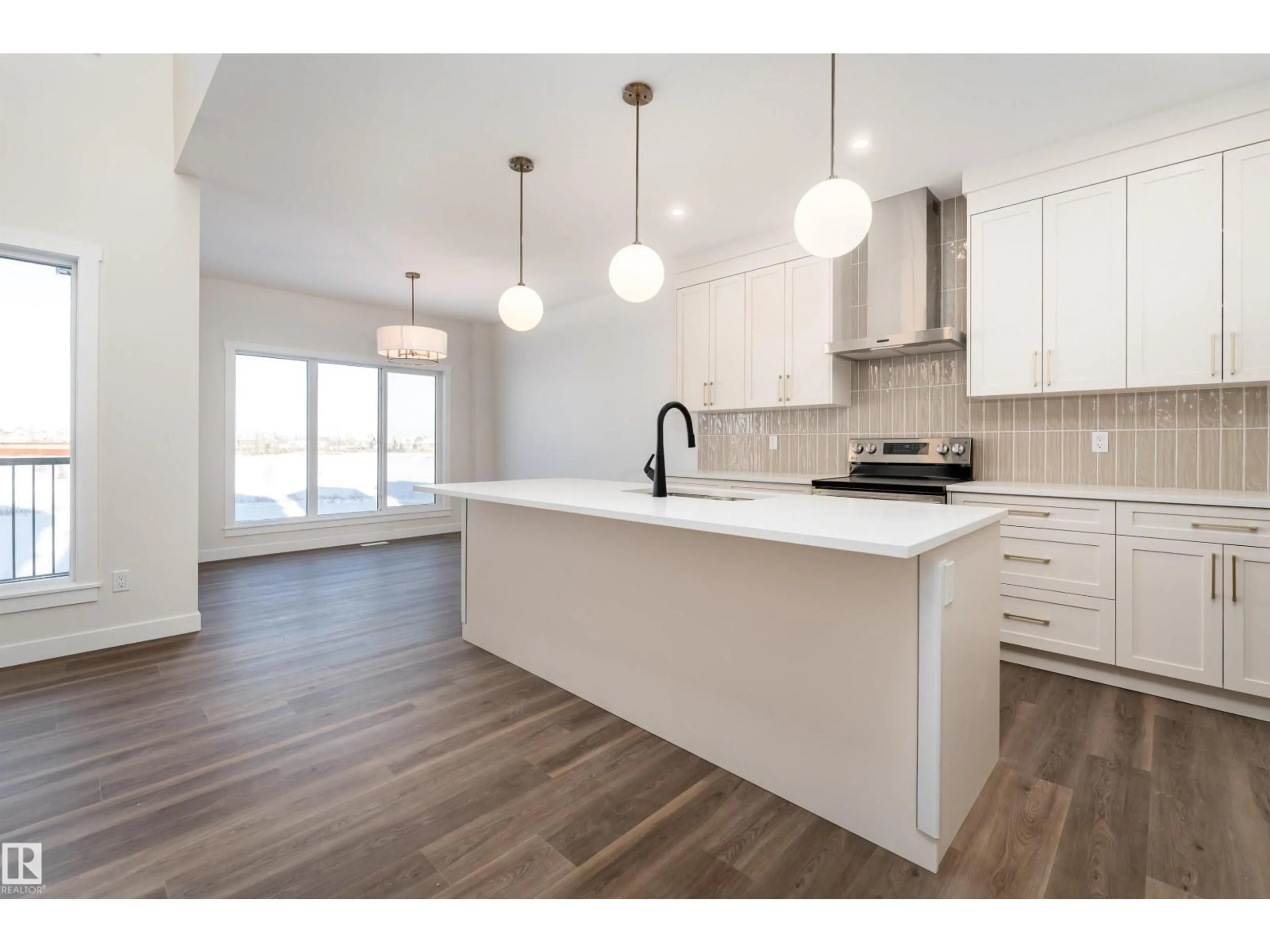 Open concept kitchen, wood/laminate floor for 6 TENUTO LI, Spruce Grove Alberta T7X3M7