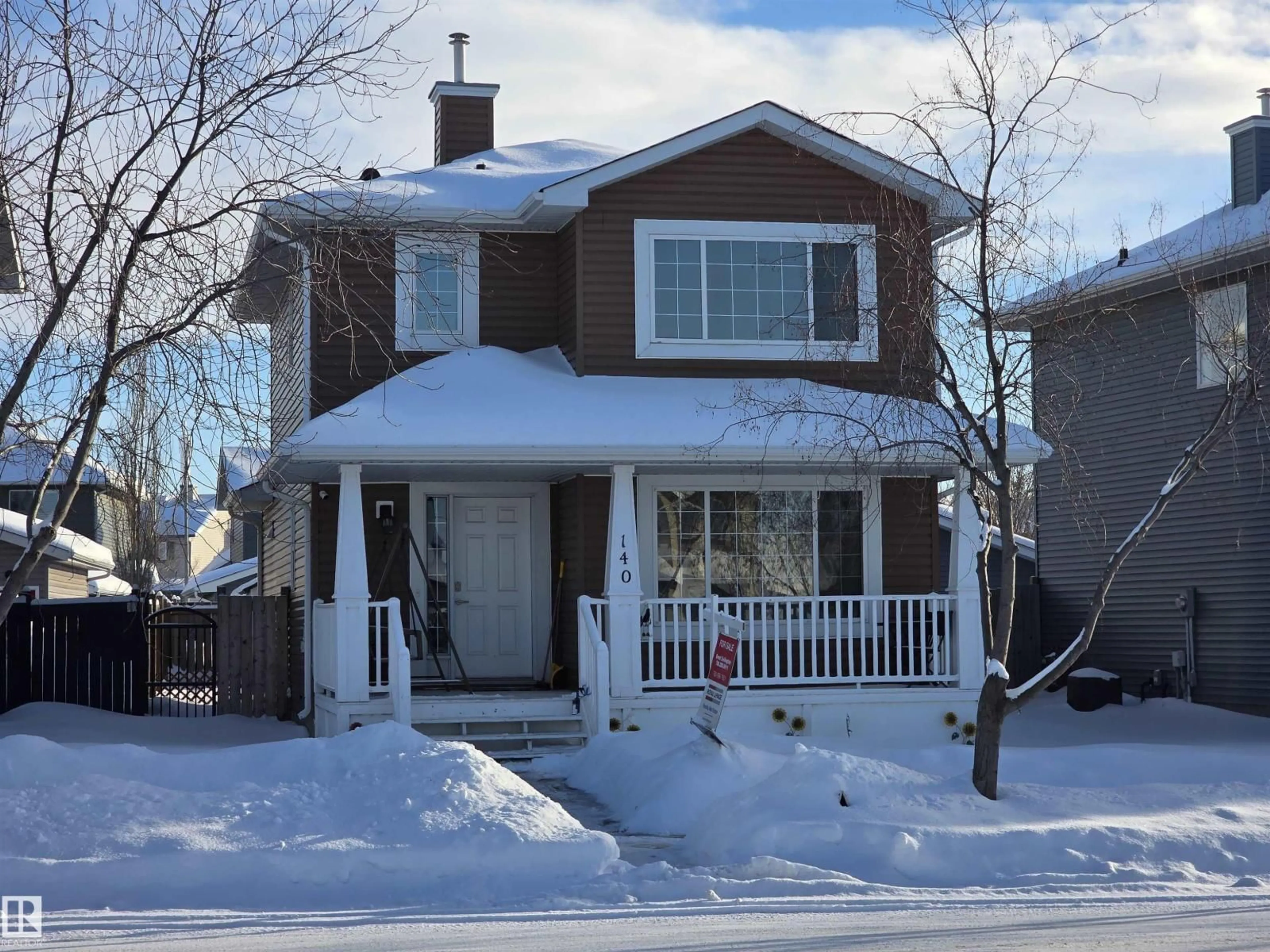 Home with vinyl exterior material, street for 140 WESTWOOD LN, Fort Saskatchewan Alberta T8L4N7