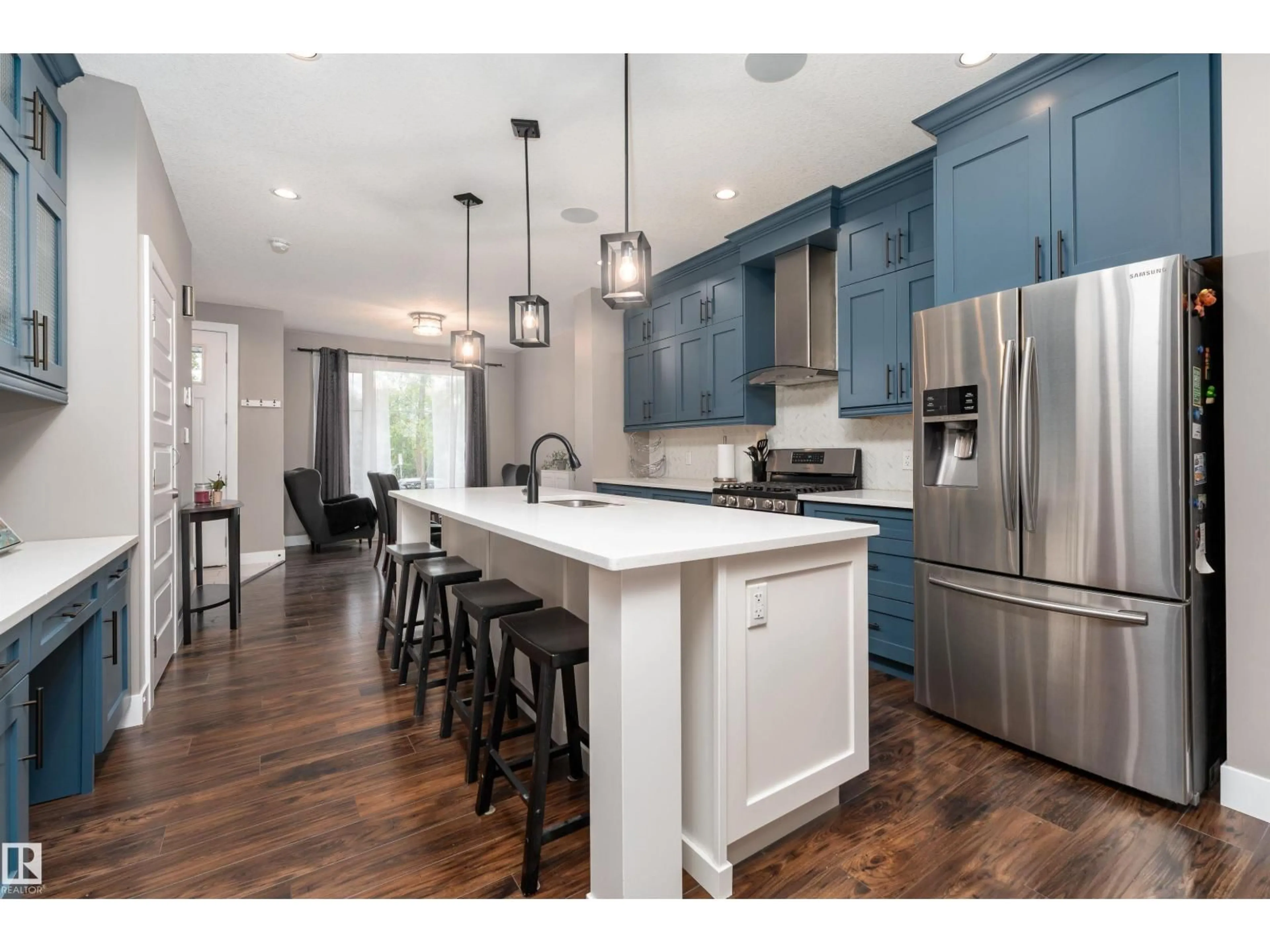 Open concept kitchen, wood/laminate floor for 10706 67 AV, Edmonton Alberta T6H1Z9