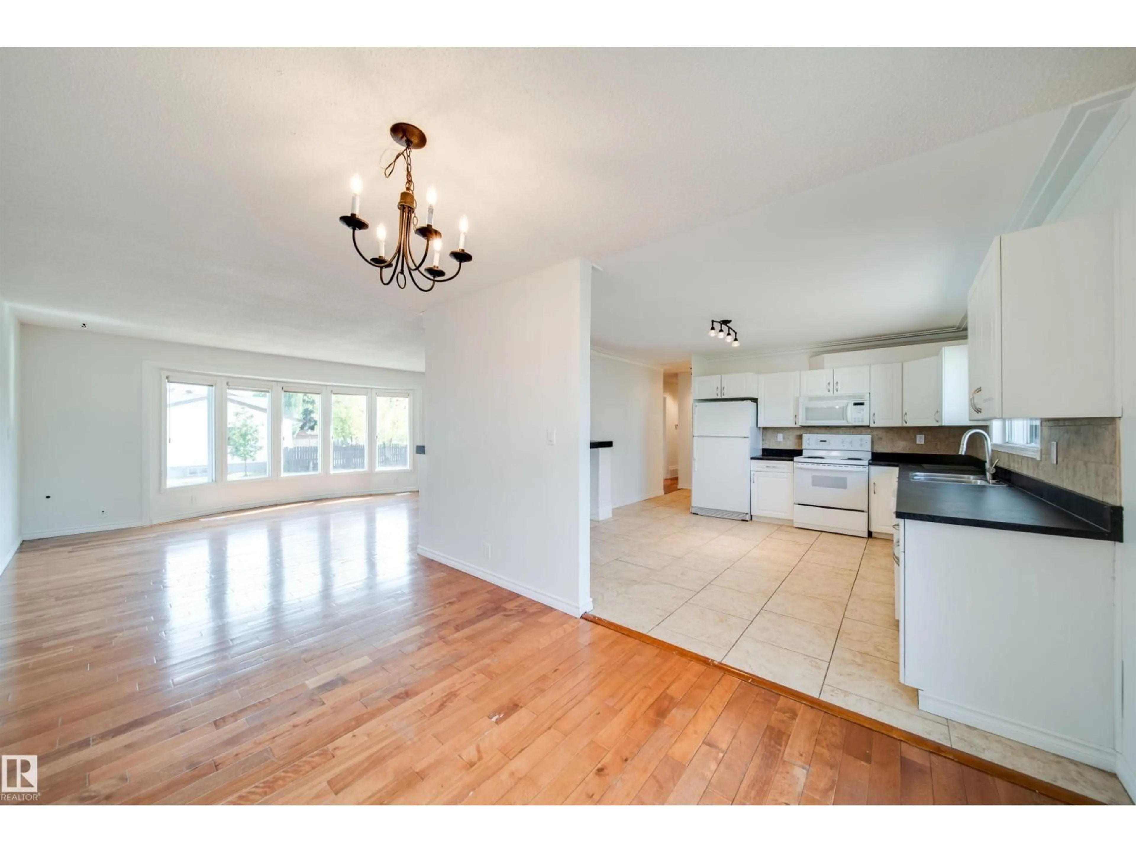 Open concept kitchen, wood/laminate floor for NW - 18851 99A AV, Edmonton Alberta T5T3M9