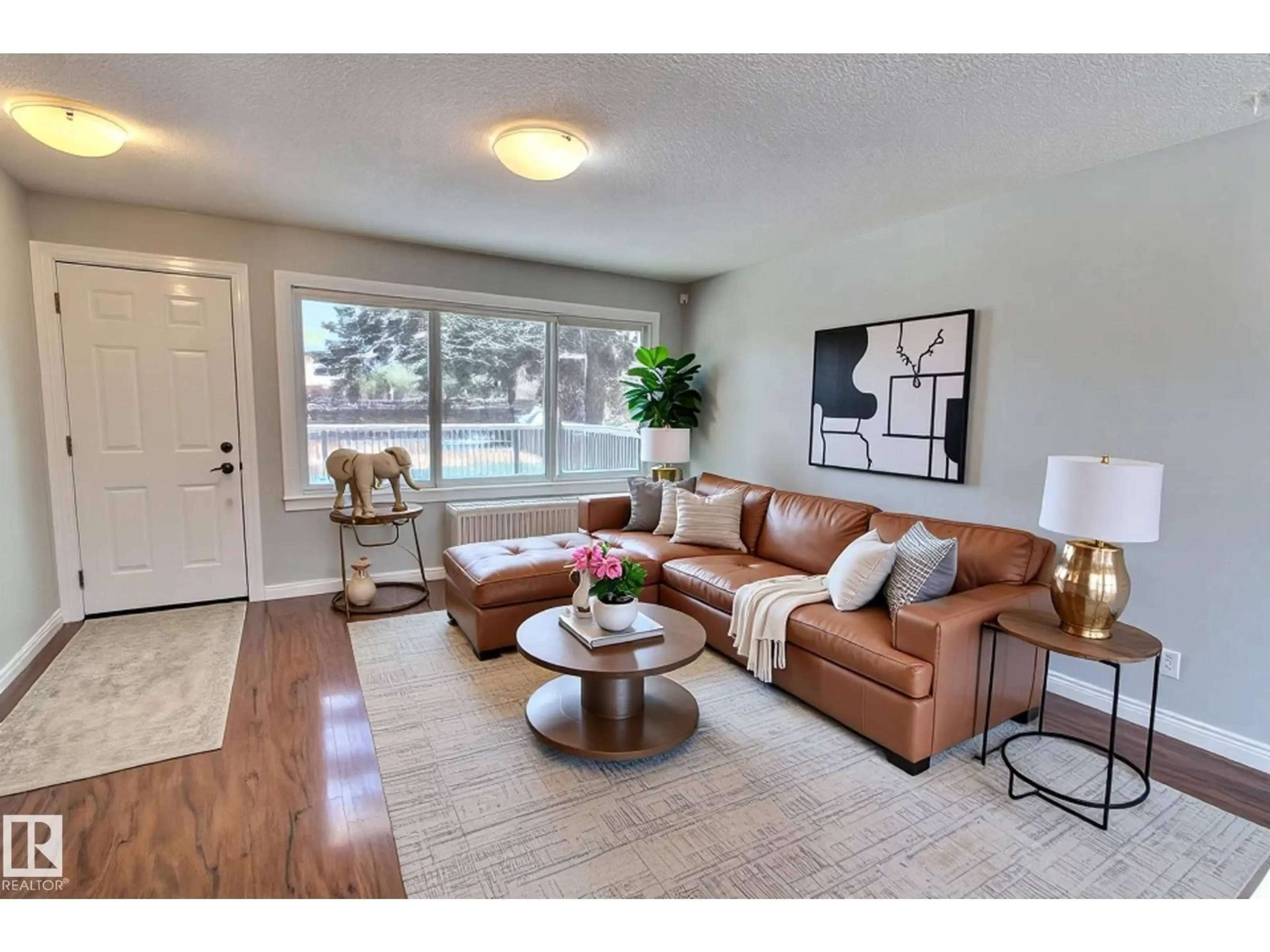 Living room with furniture, wood/laminate floor for 30 ARLINGTON ST, Spruce Grove Alberta T7X2E7