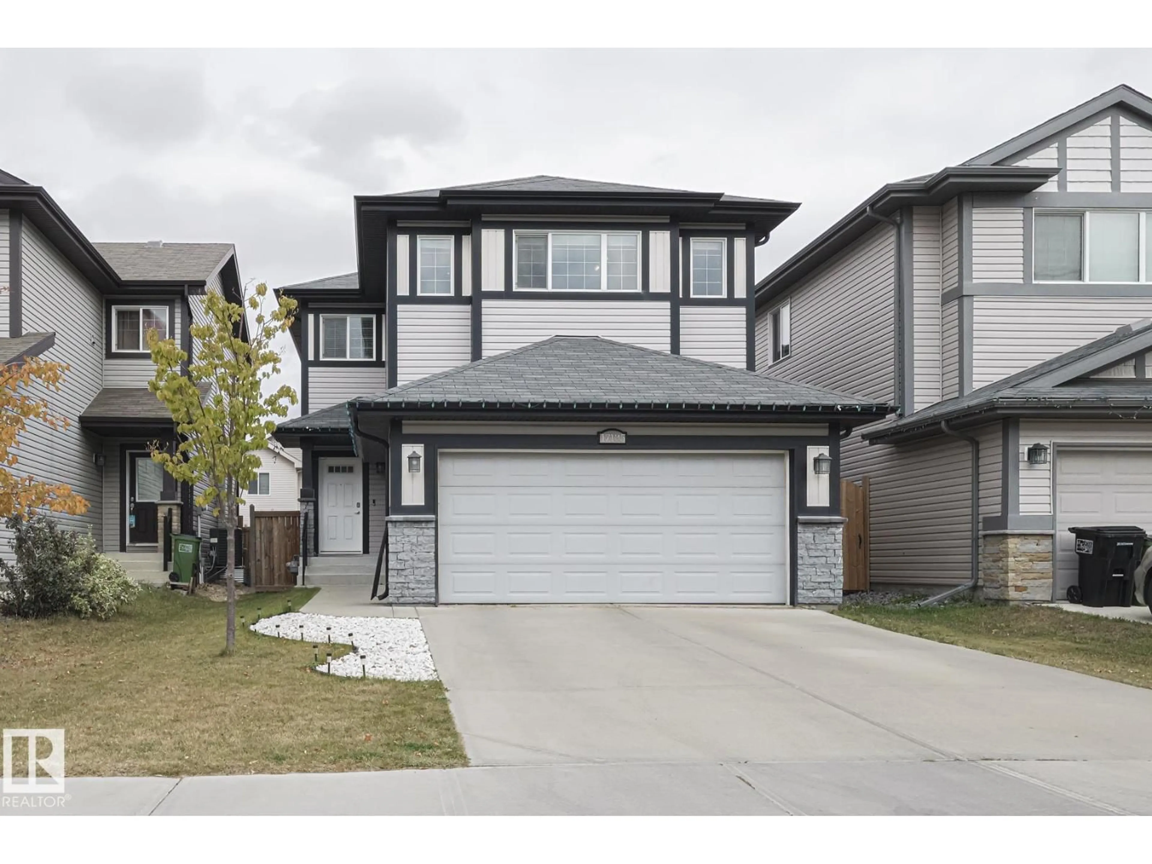 Home with vinyl exterior material, street for NW - 17135 47 ST, Edmonton Alberta T5Y3P4