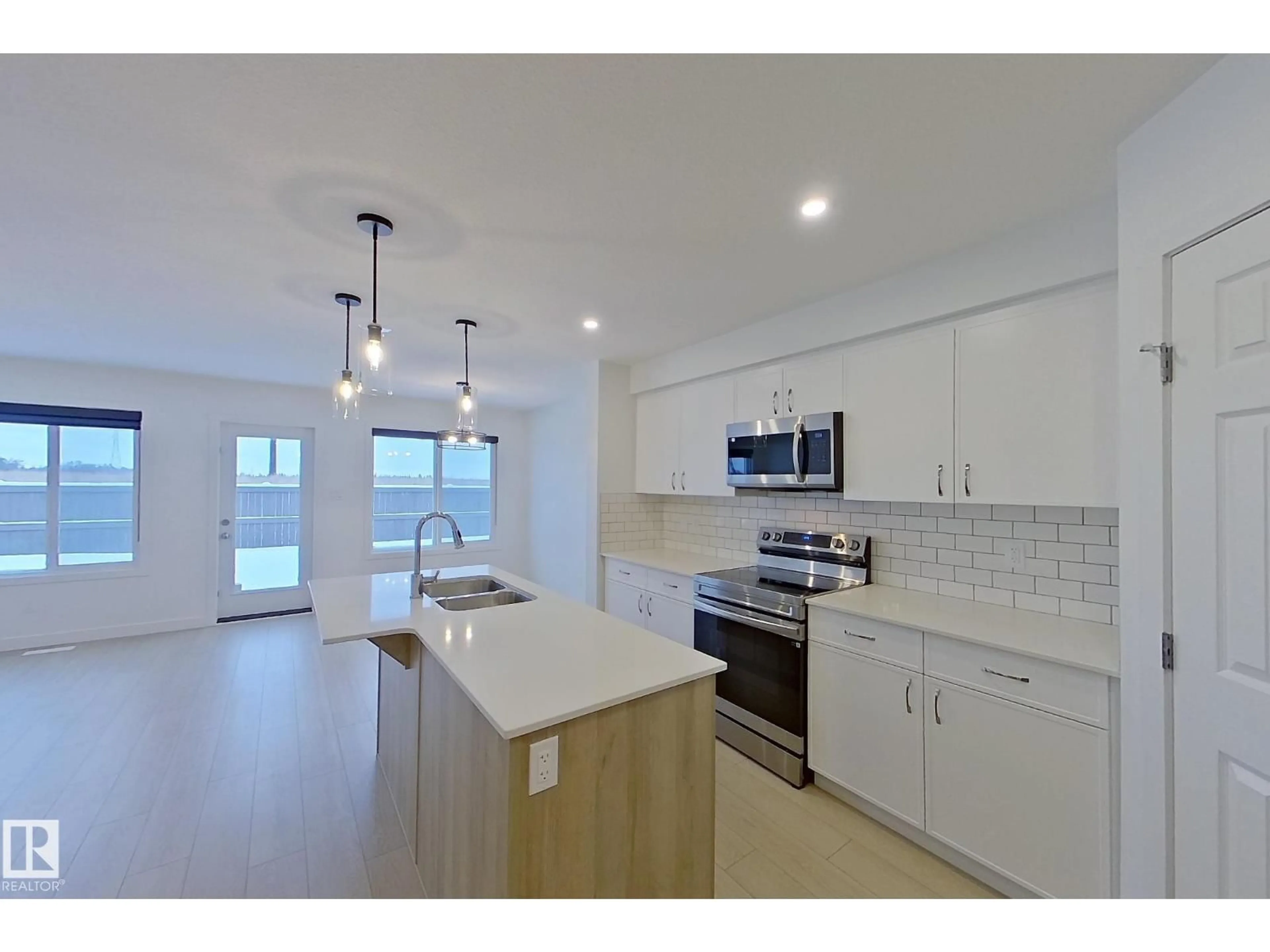 Open concept kitchen, unknown for 18910 29 AV, Edmonton Alberta T6M3C4