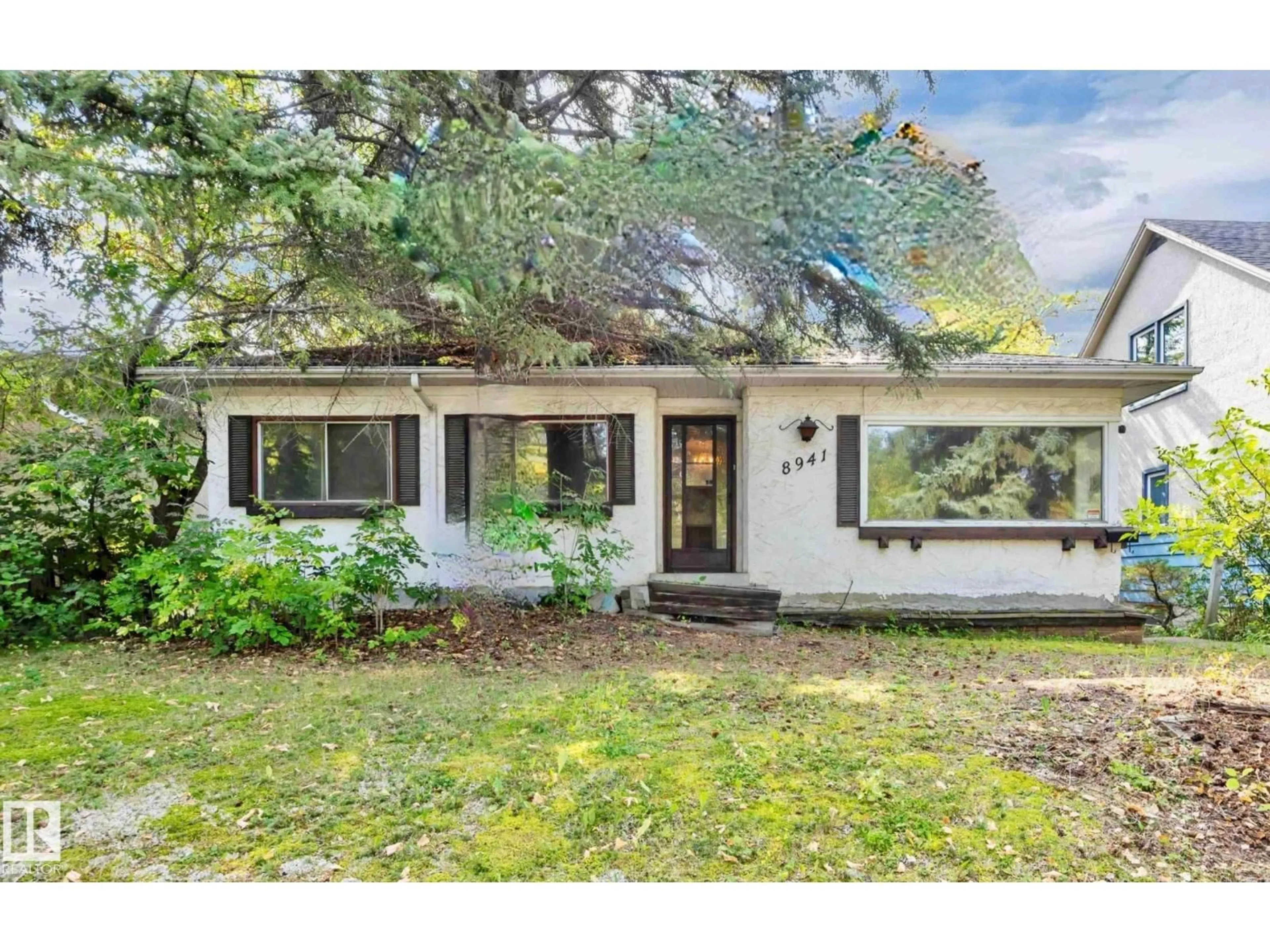 Home with vinyl exterior material, street for NW - 8941 79 AV, Edmonton Alberta T6C0R7