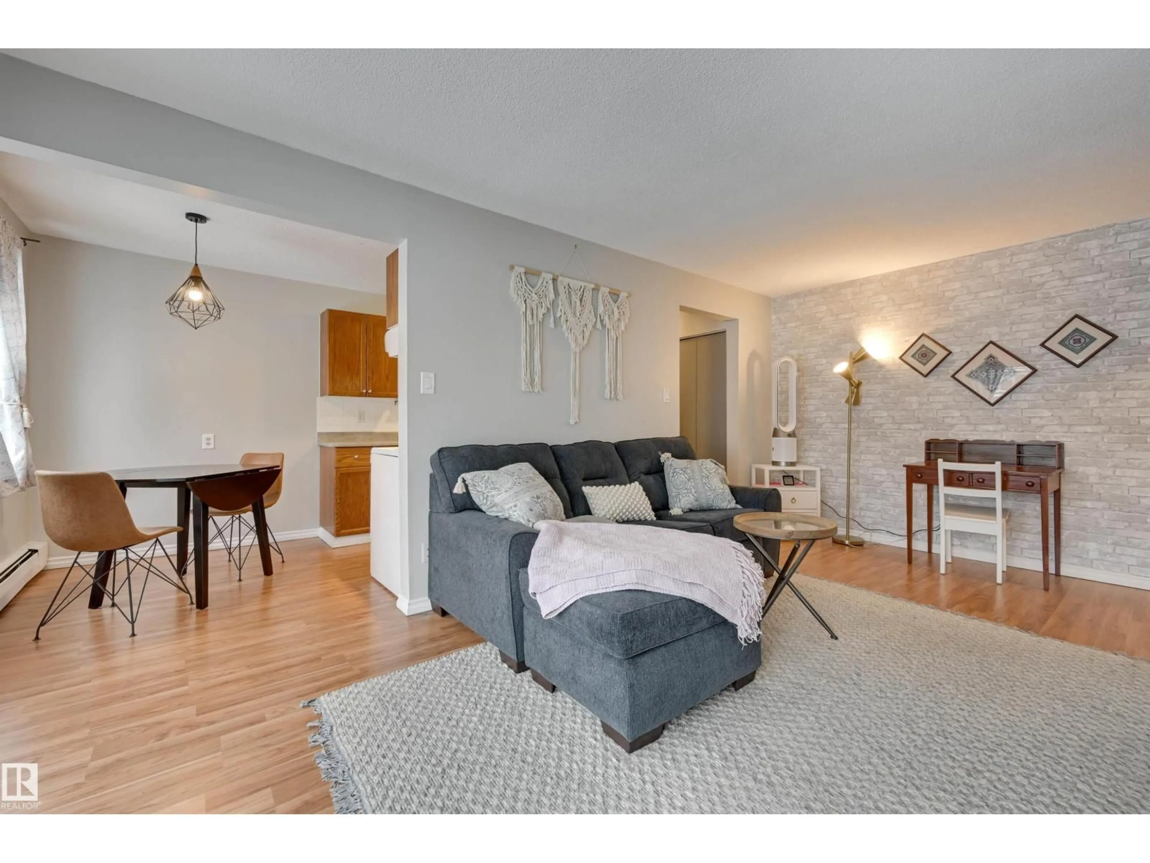 Living room with furniture, wood/laminate floor for #302 - 10230 114 ST, Edmonton Alberta T5K1R9
