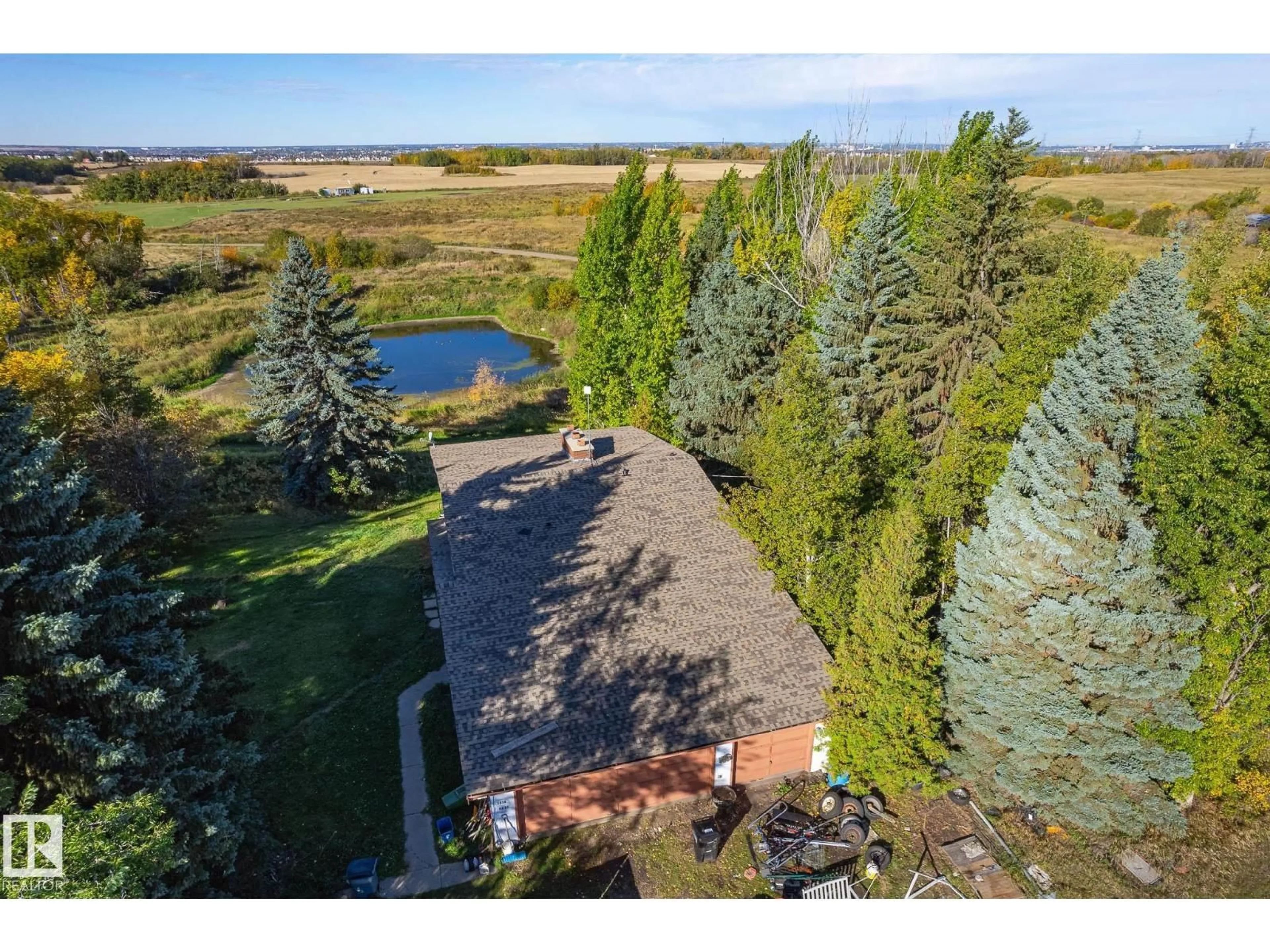 A pic from outside/outdoor area/front of a property/back of a property/a pic from drone, water/lake/river/ocean view for SW - 1450 34 ST, Edmonton Alberta T6X1A5