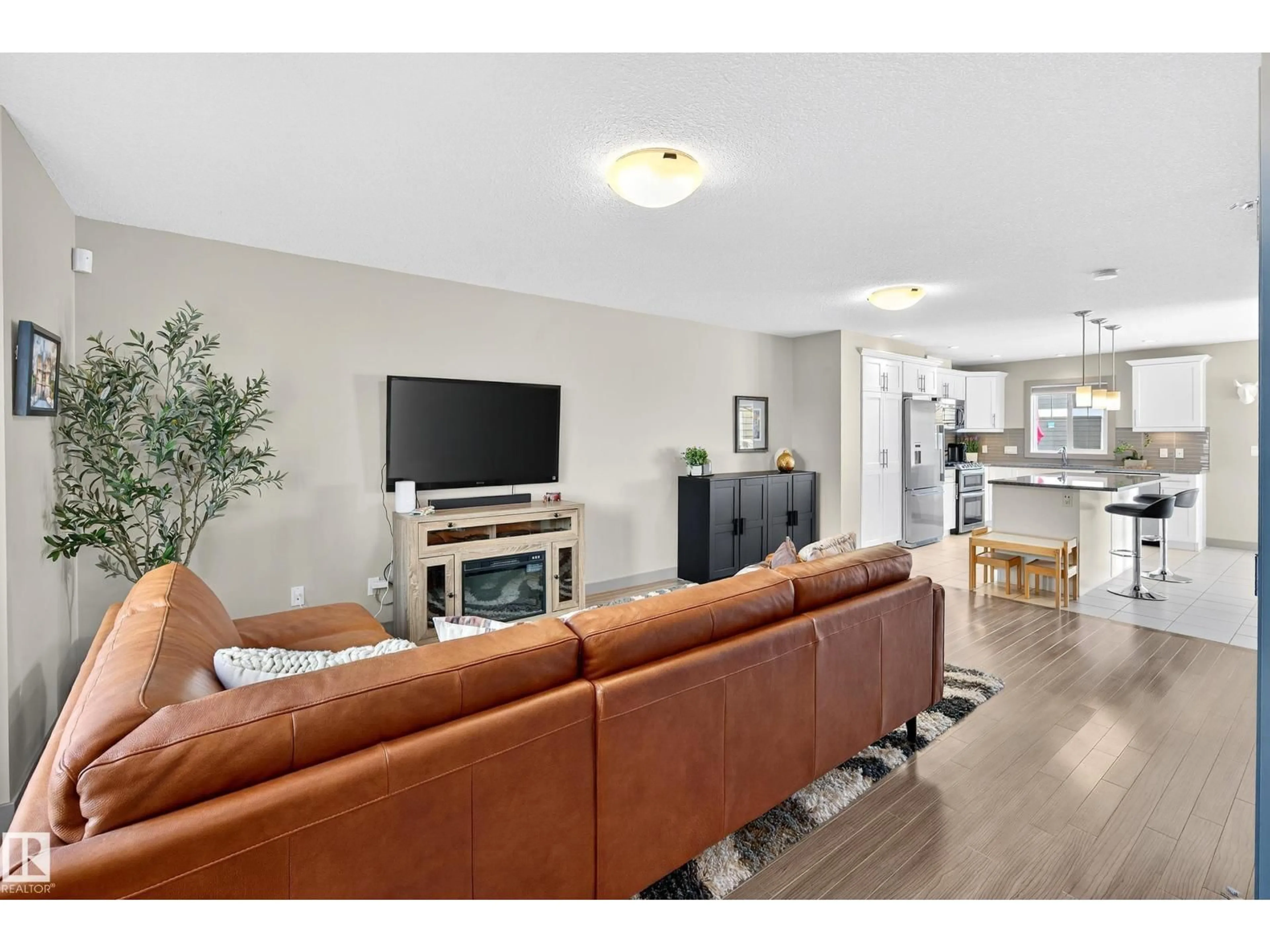 Living room with furniture, unknown for #6 - 1150 WINDEREMERE WY, Edmonton Alberta T6W2B6