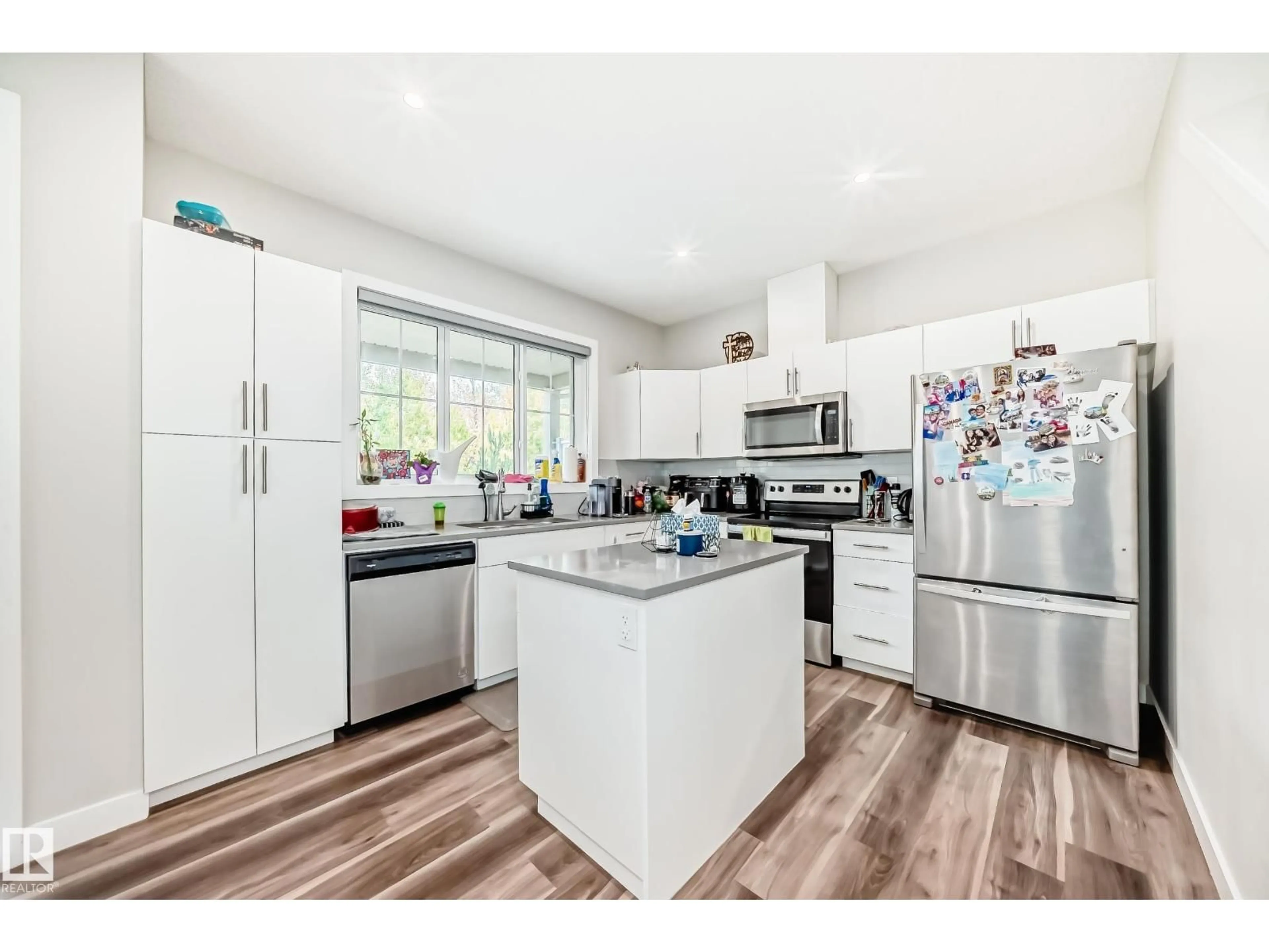 Open concept kitchen, wood/laminate floor for 1051 GRAYDON HILL BV, Edmonton Alberta T6W3C8