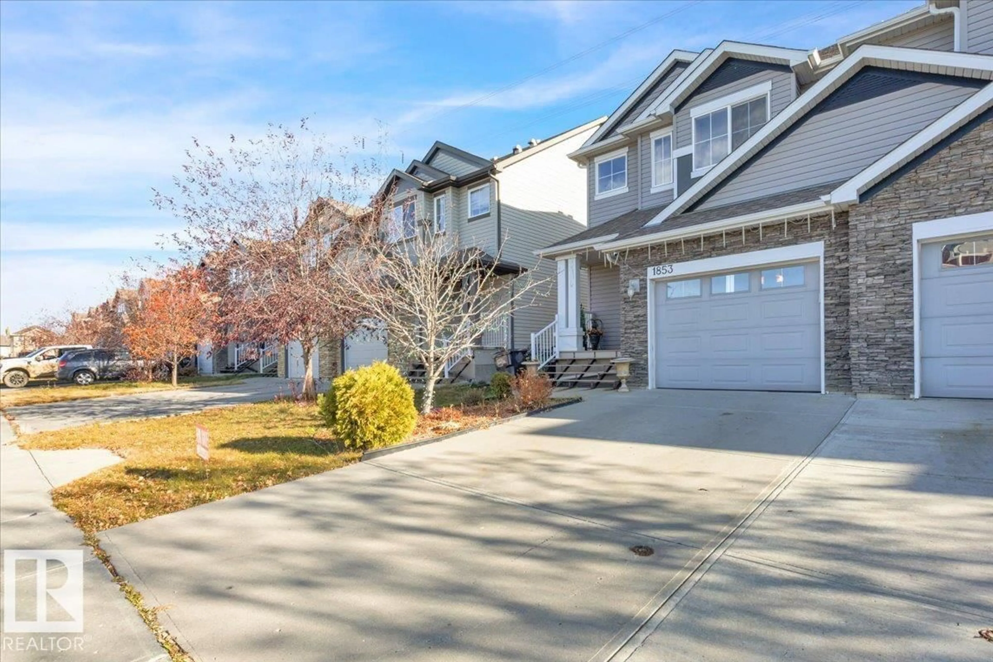 Home with vinyl exterior material, street for 1853 28 ST, Edmonton Alberta T6T0N5