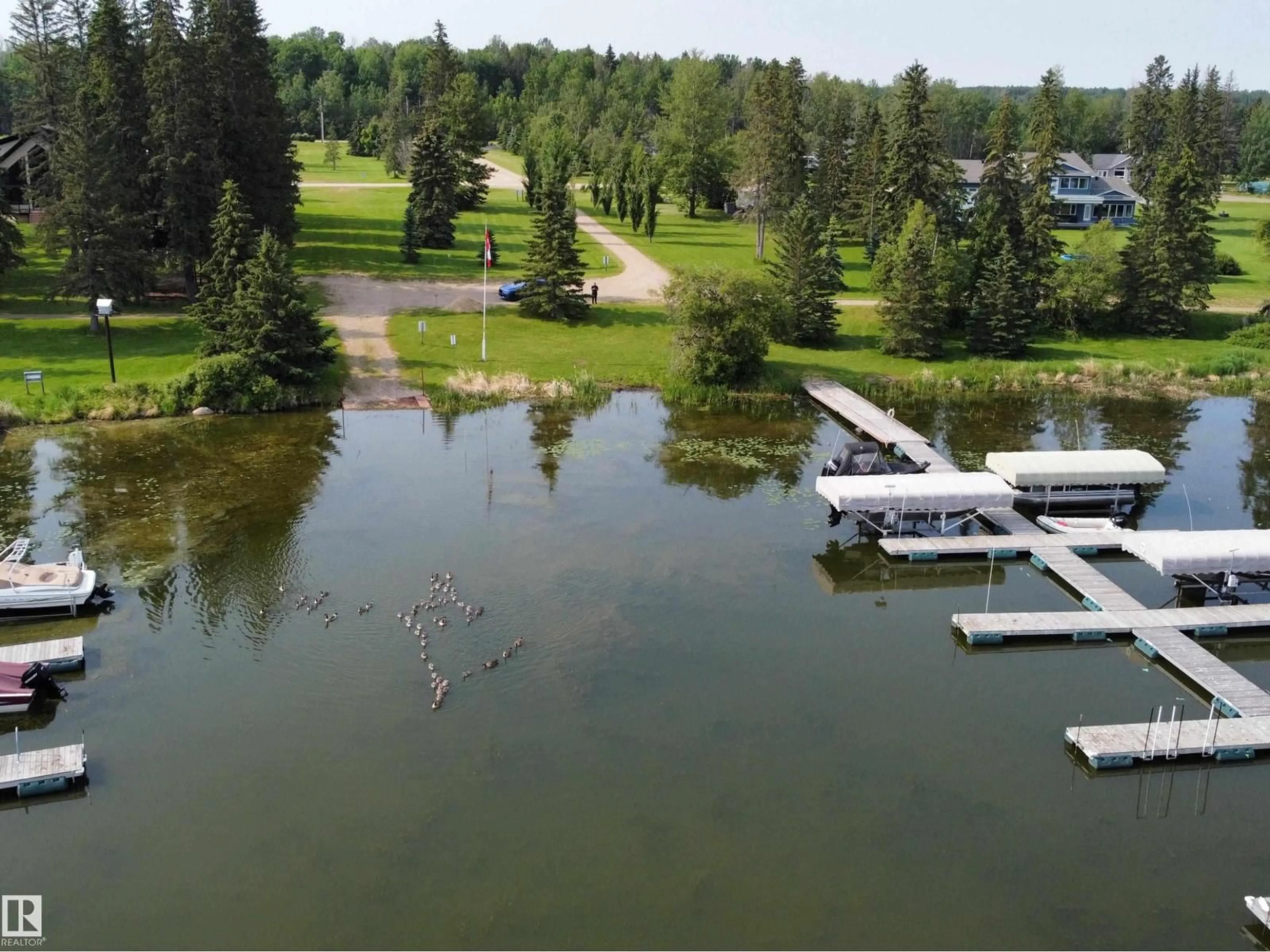 A pic from outside/outdoor area/front of a property/back of a property/a pic from drone, water/lake/river/ocean view for 260 465015 RANGE ROAD 63A, Rural Wetaskiwin County Alberta T0C0T0