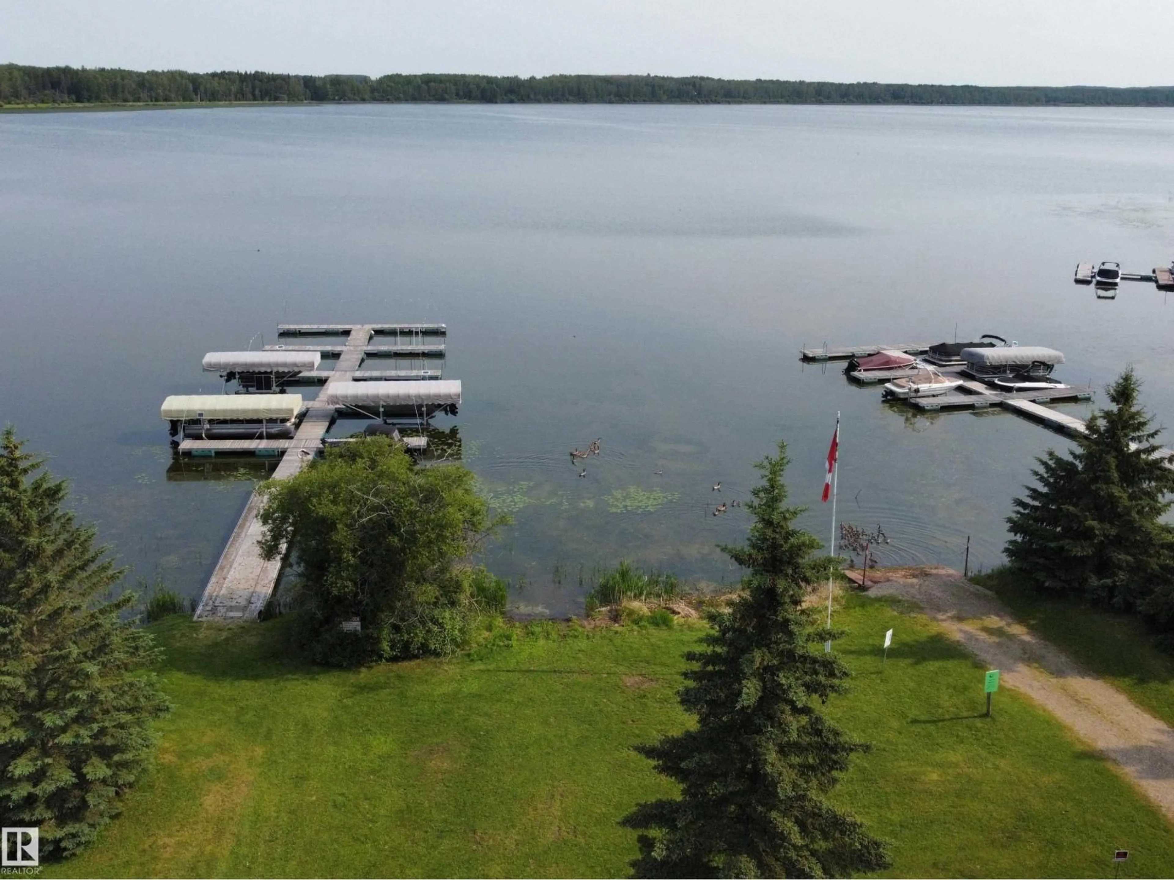 A pic from outside/outdoor area/front of a property/back of a property/a pic from drone, water/lake/river/ocean view for 260 465015 RANGE ROAD 63A, Rural Wetaskiwin County Alberta T0C0T0