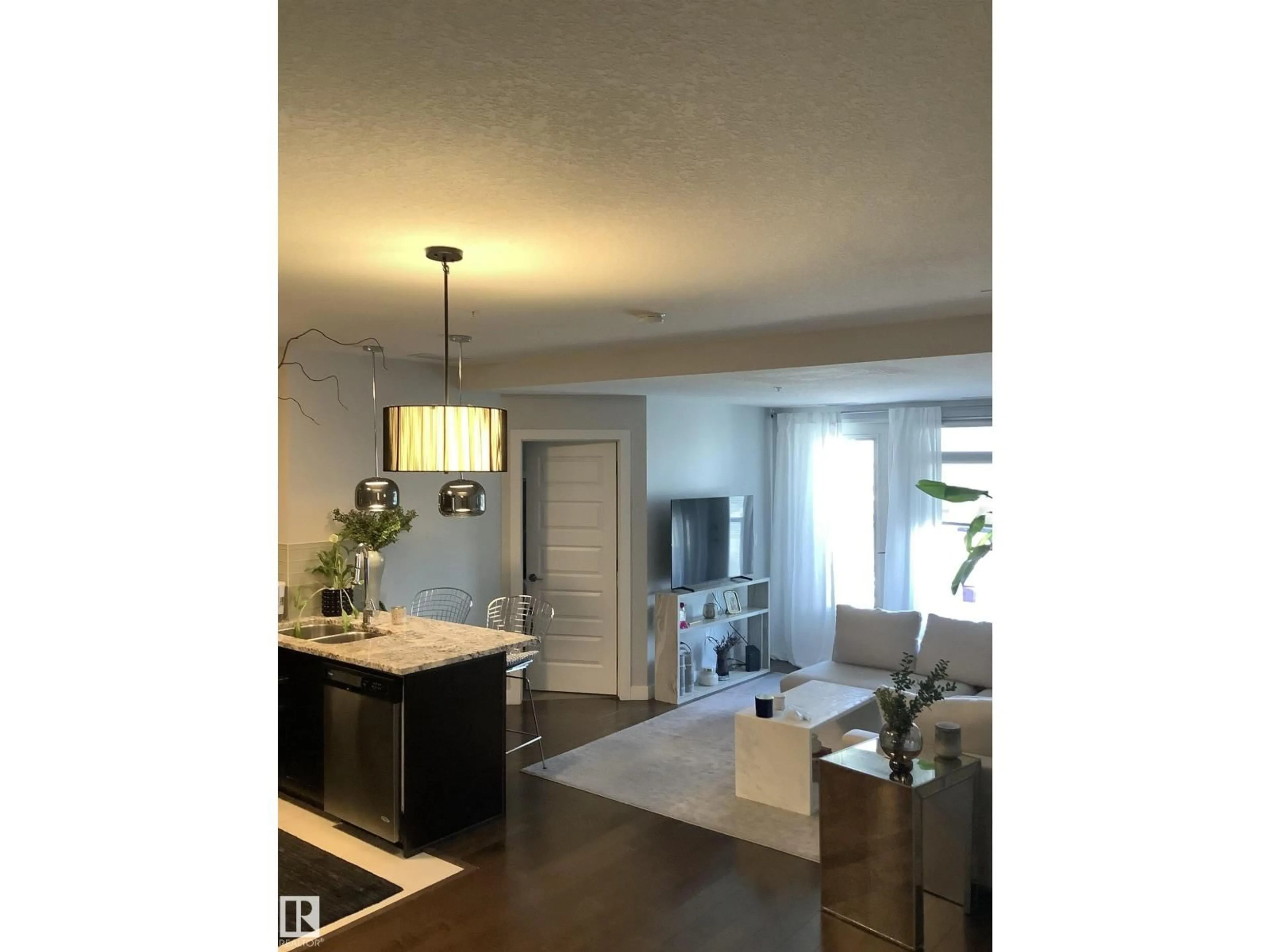 Open concept kitchen, wood/laminate floor for 531 5151 WINDERMERE BV, Edmonton Alberta T6W2K4