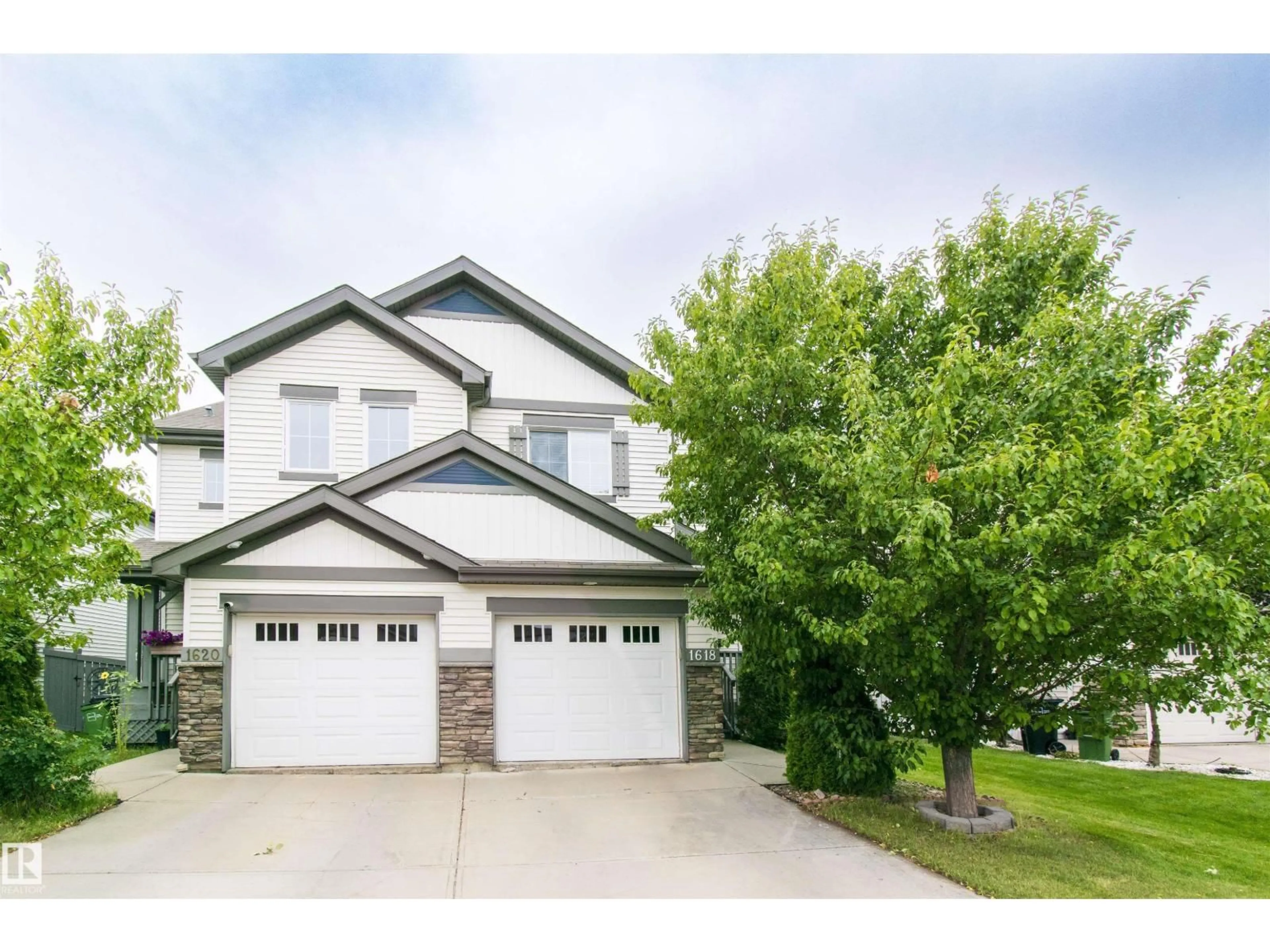 Home with vinyl exterior material, street for 1618 64 ST, Edmonton Alberta T6X0N2