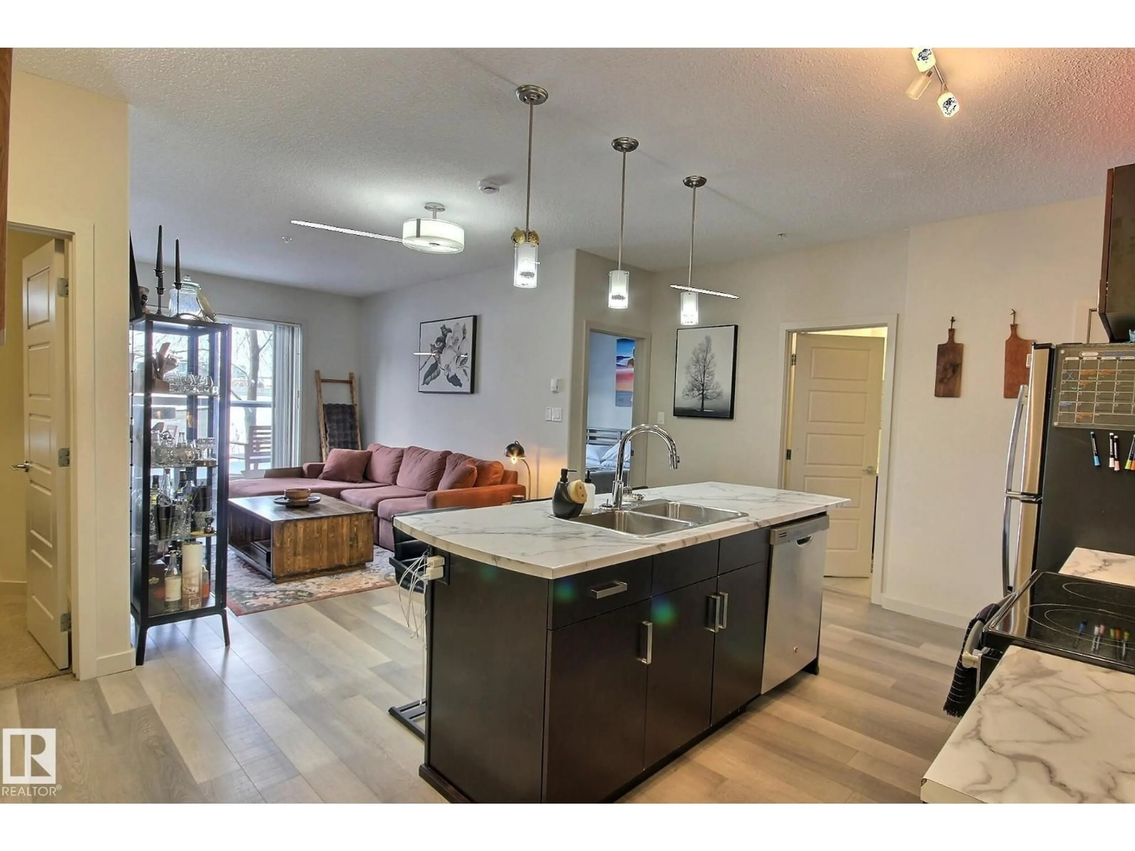 Open concept kitchen, unknown for #104 - 320 AMBLESIDE LINK, Edmonton Alberta T6W2Z9