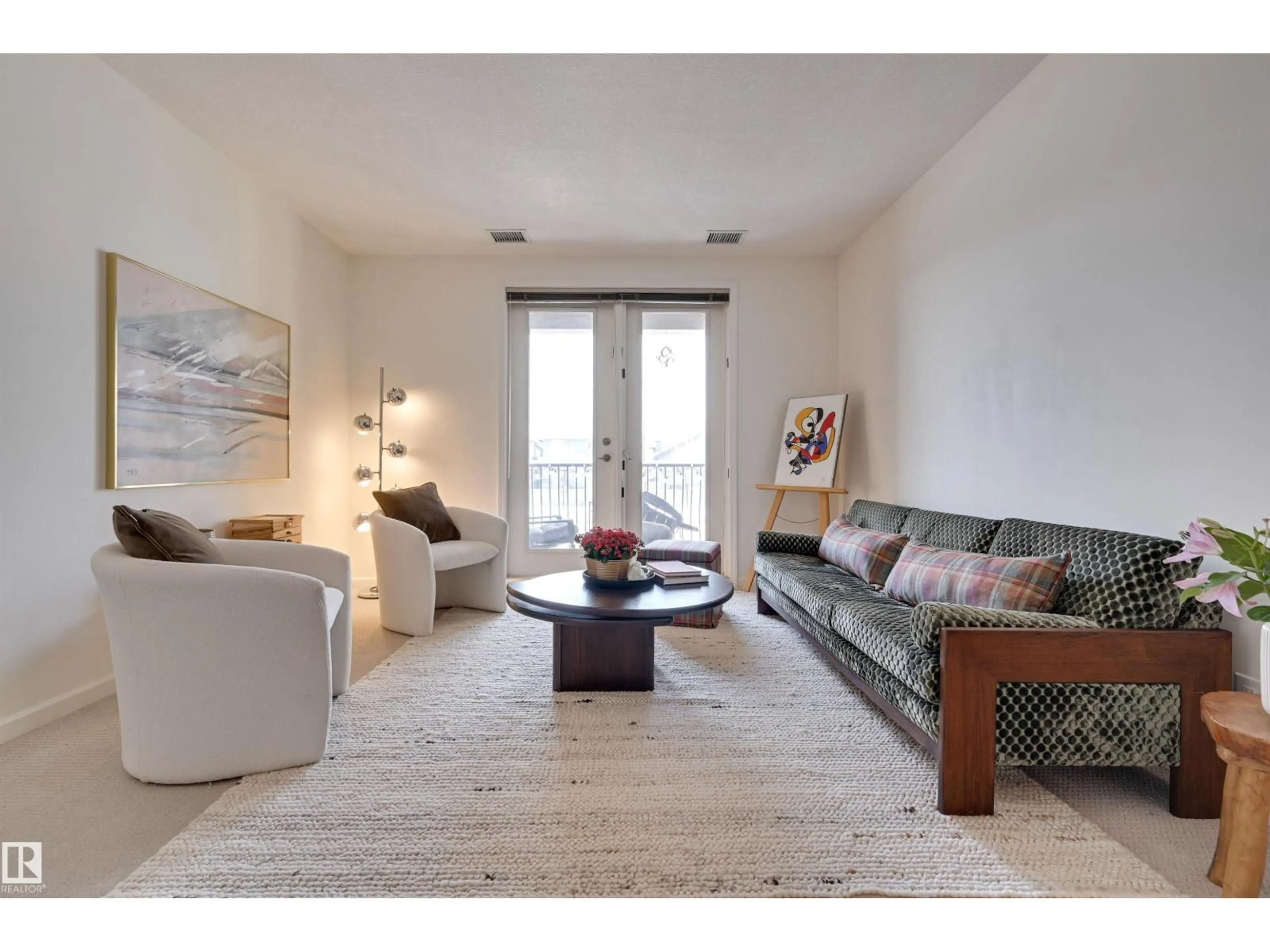 Living room with furniture, unknown for 6083 - 221 MAYNARD WY, Edmonton Alberta T6R0S5