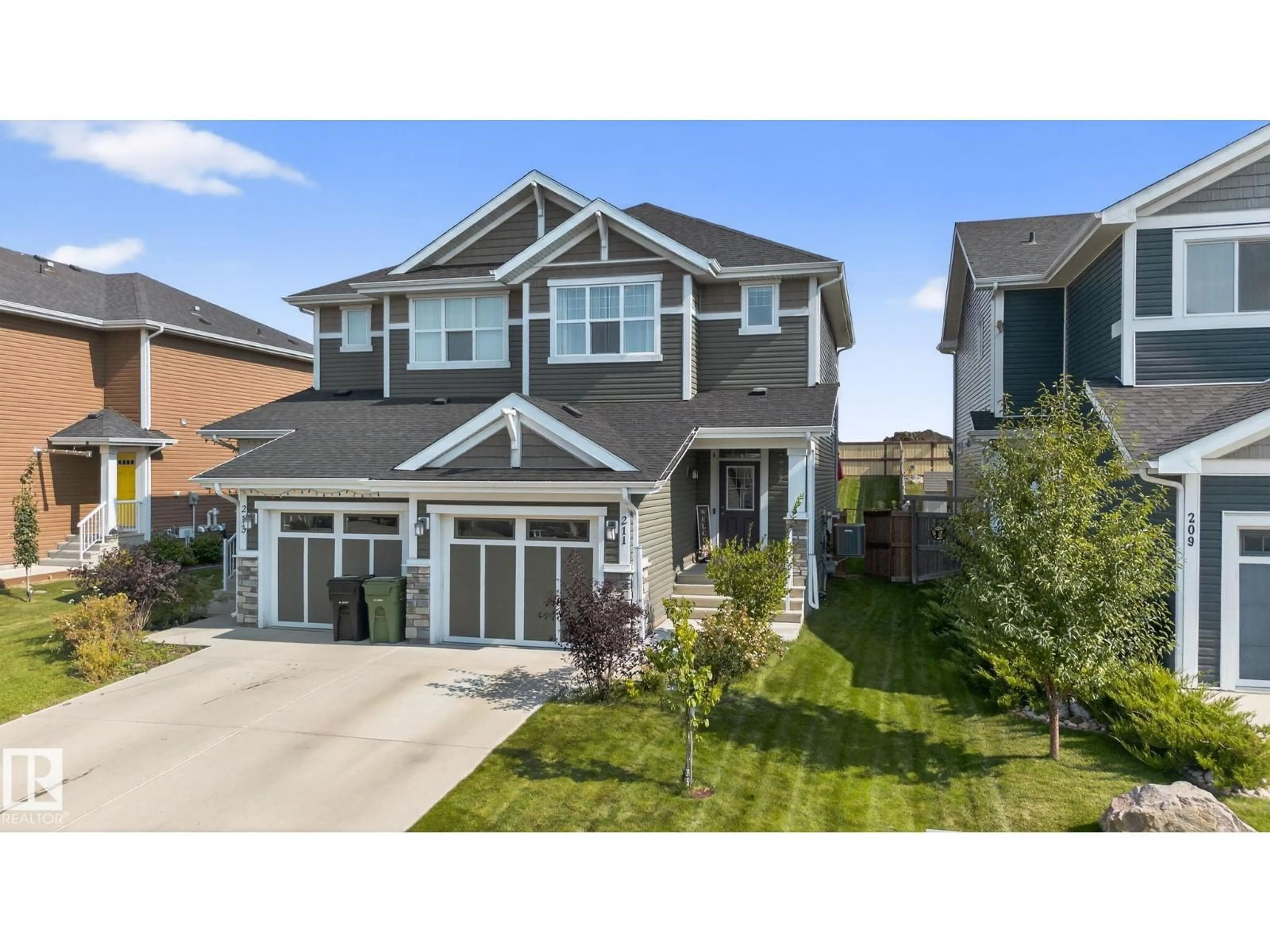 Home with vinyl exterior material, street for 211 STURTZ BEND, Leduc Alberta T9E0Y6