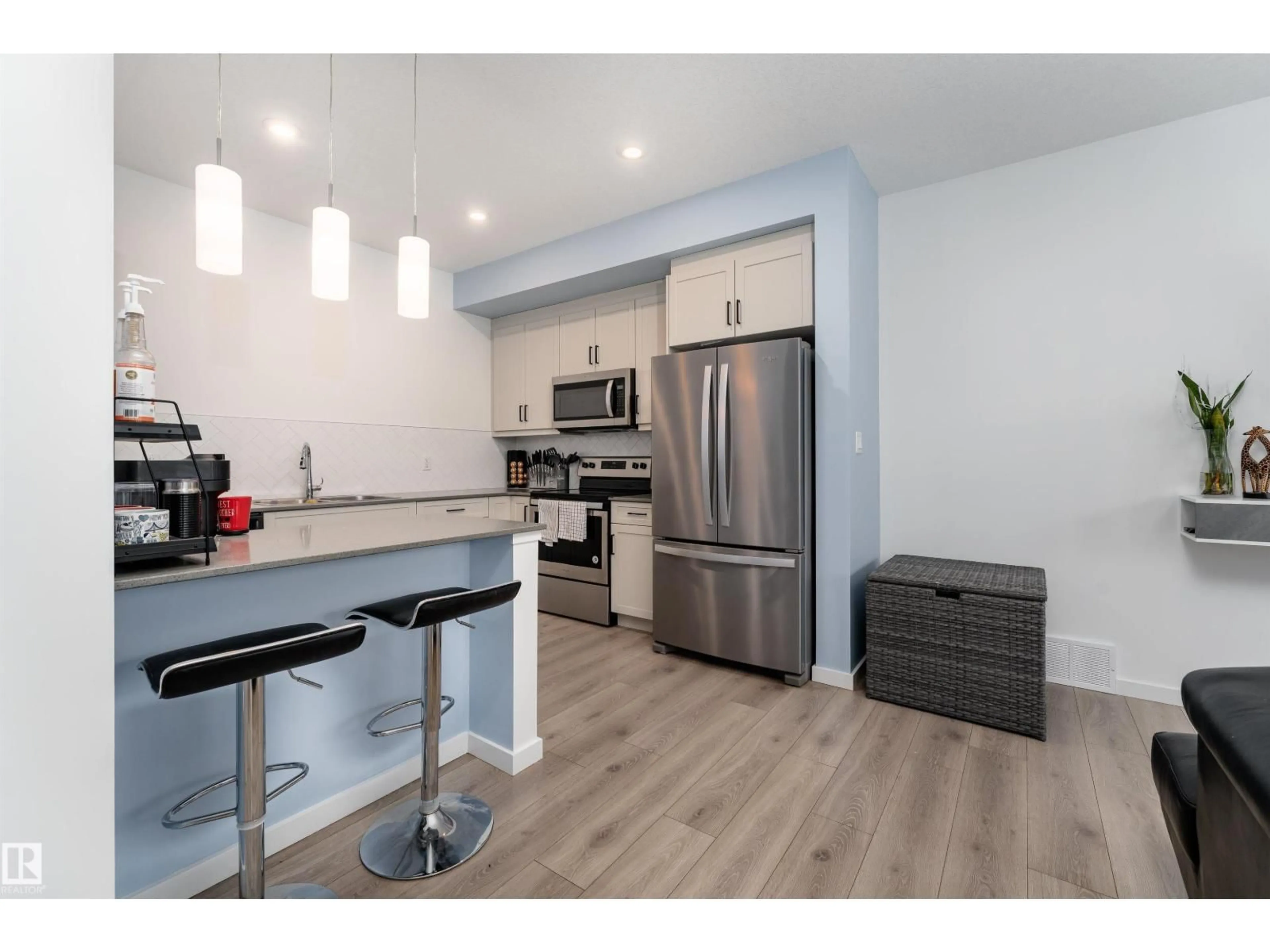 Open concept kitchen, wood/laminate floor for #105 - 1304 RUTHERFORD RD, Edmonton Alberta T6W0B4