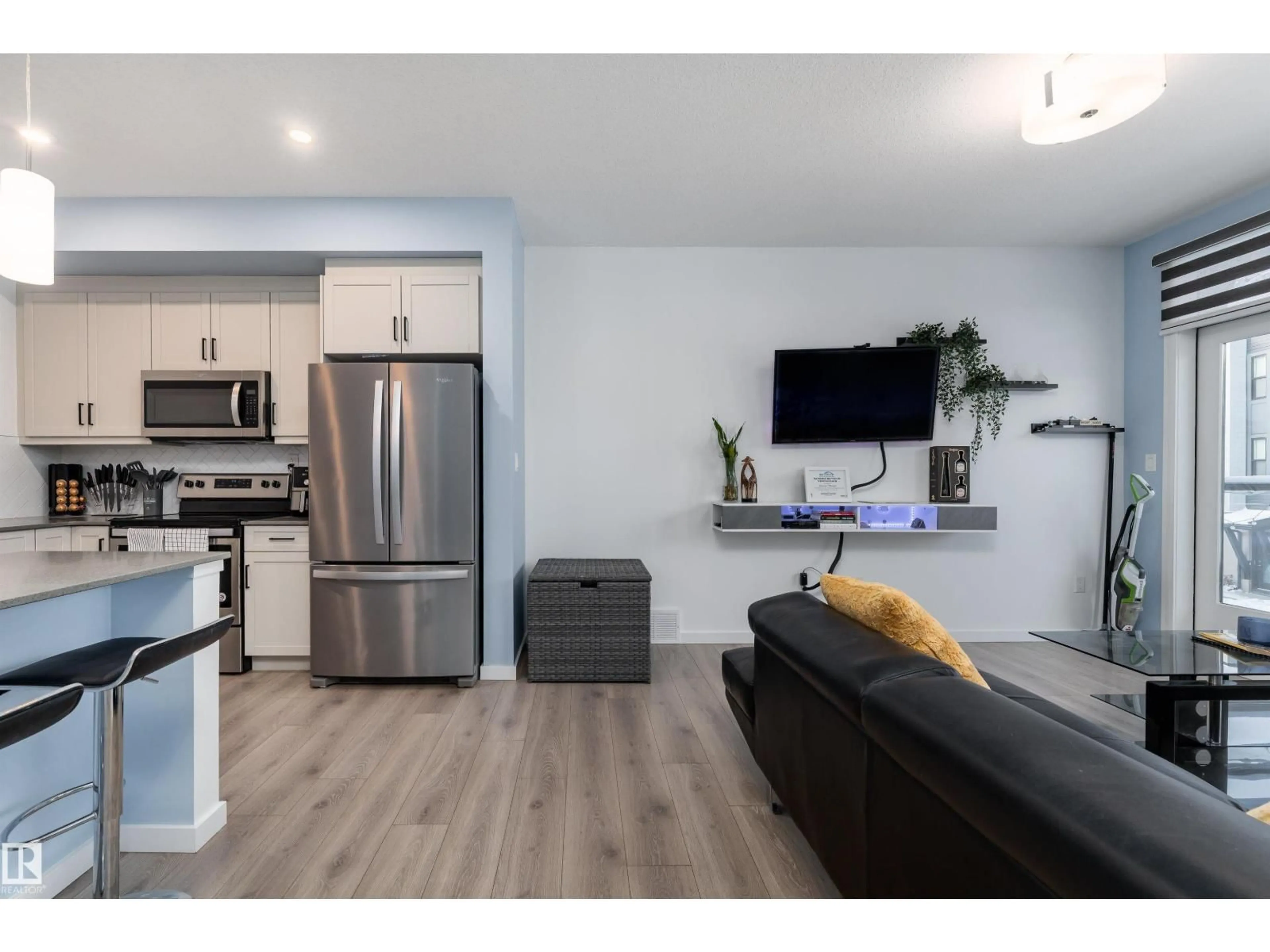 Open concept kitchen, wood/laminate floor for #105 - 1304 RUTHERFORD RD, Edmonton Alberta T6W0B4