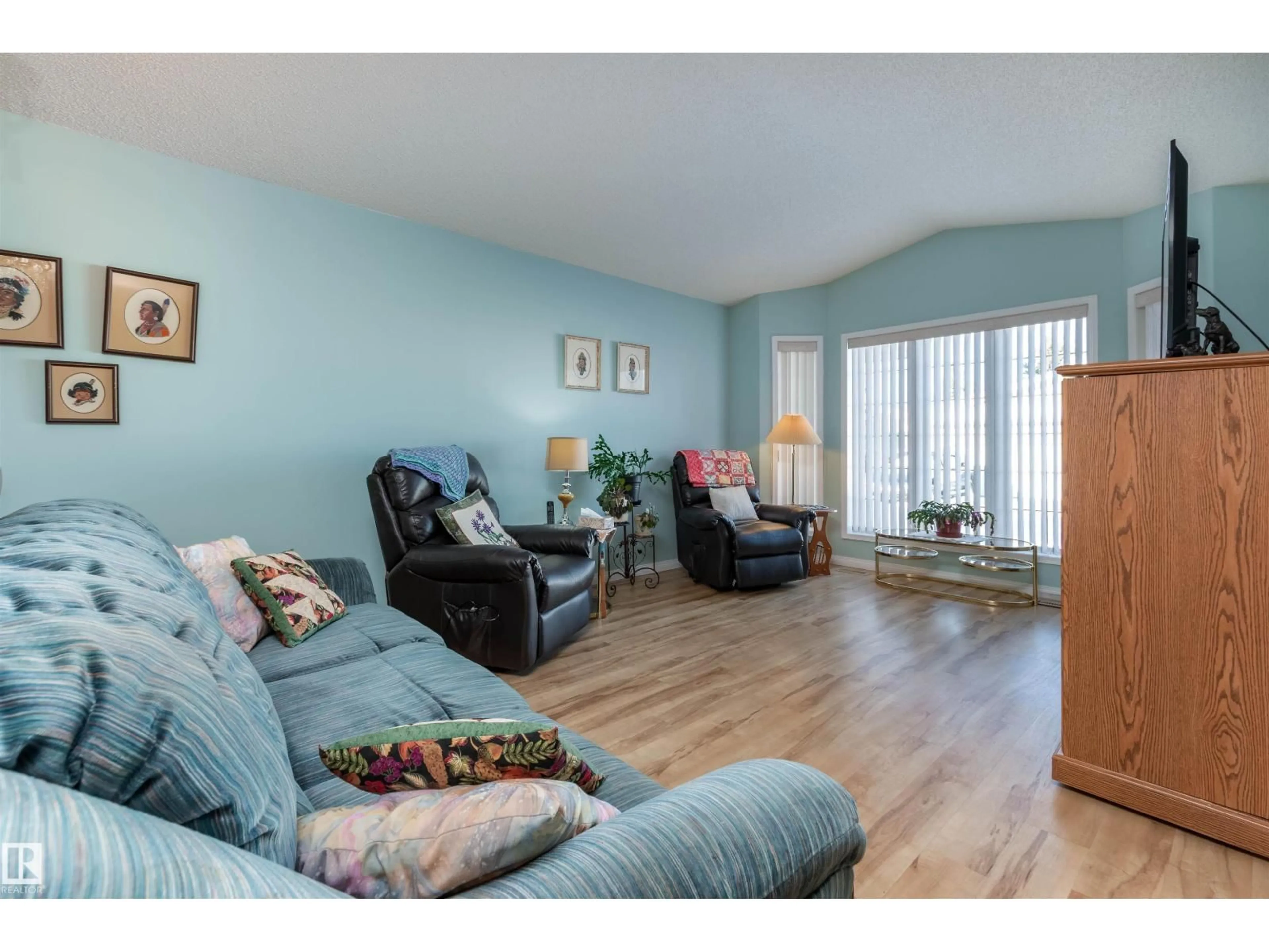 Living room with furniture, wood/laminate floor for 7 - 26 CRANFORD WY, Sherwood Park Alberta T8H5W5