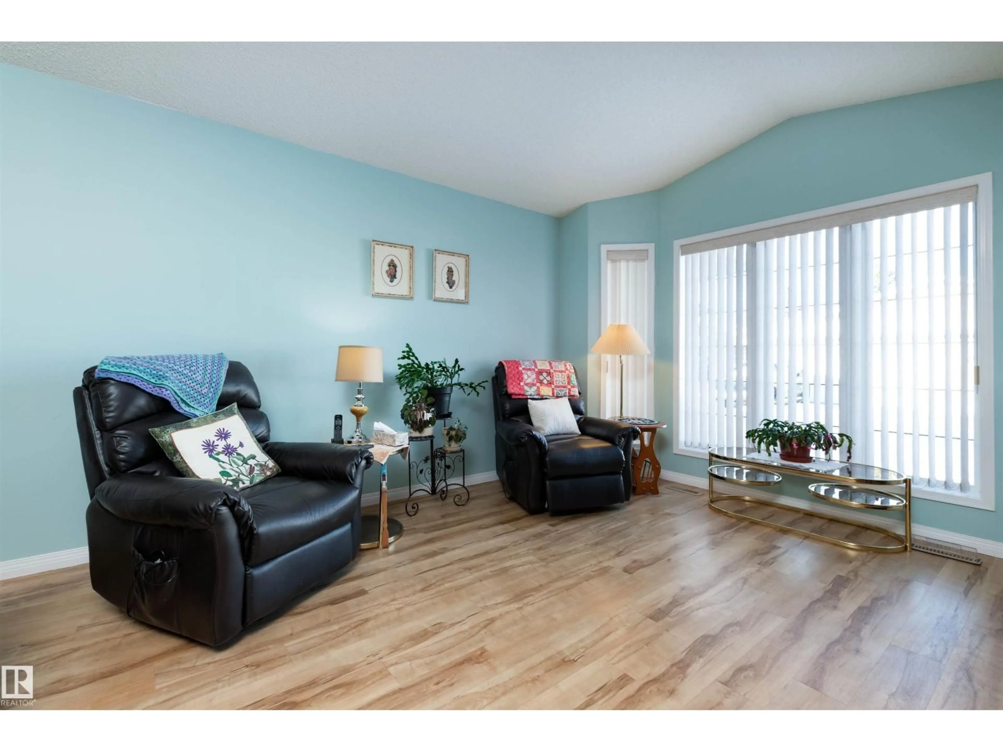 Living room with furniture, wood/laminate floor for 7 - 26 CRANFORD WY, Sherwood Park Alberta T8H5W5