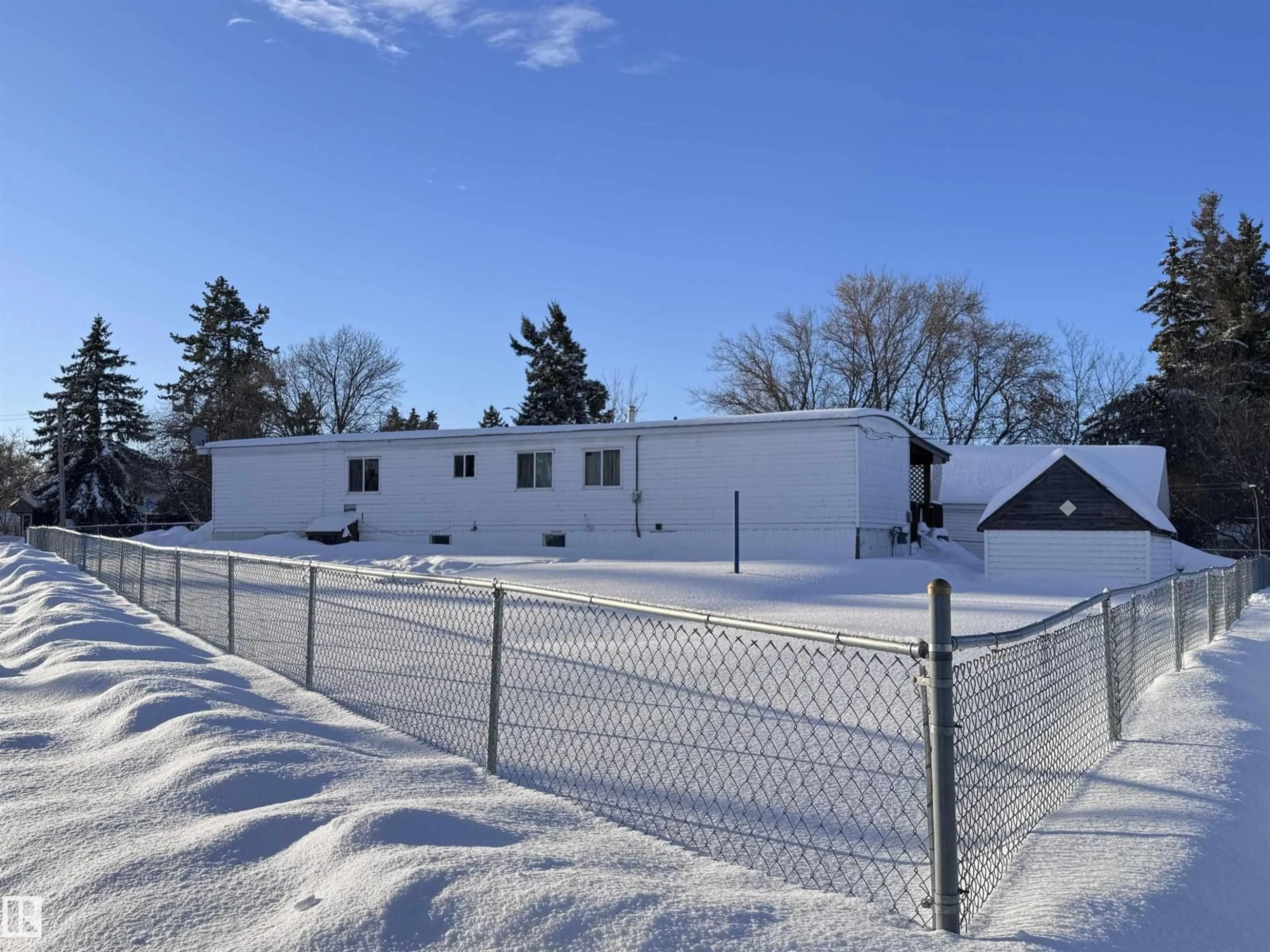 A pic from outside/outdoor area/front of a property/back of a property/a pic from drone, building for 9940 110 ST, Westlock Alberta T7P1N5