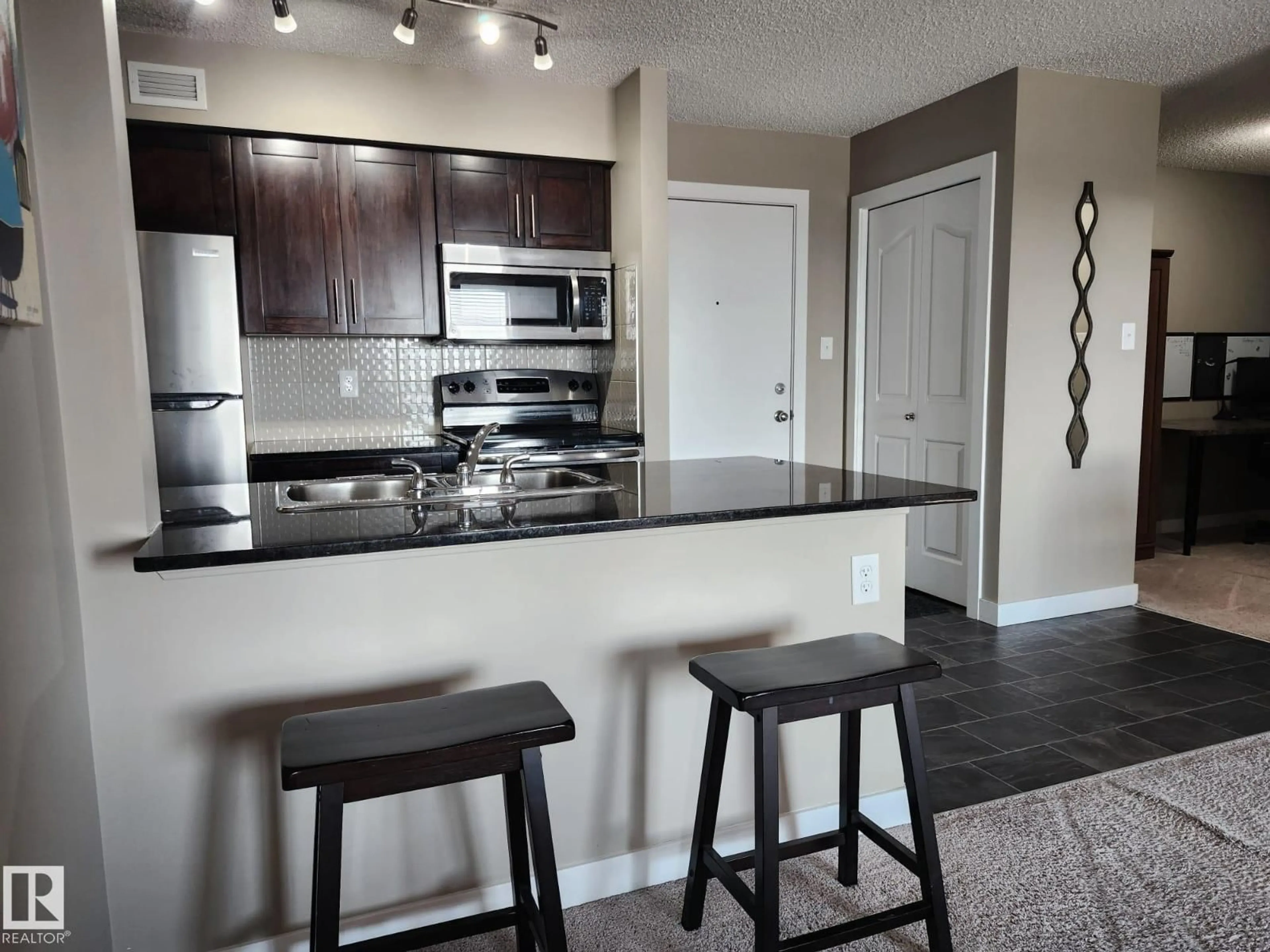 Open concept kitchen, unknown for #407 - 270 MCCONACHIE DR, Edmonton Alberta T5Y3N4