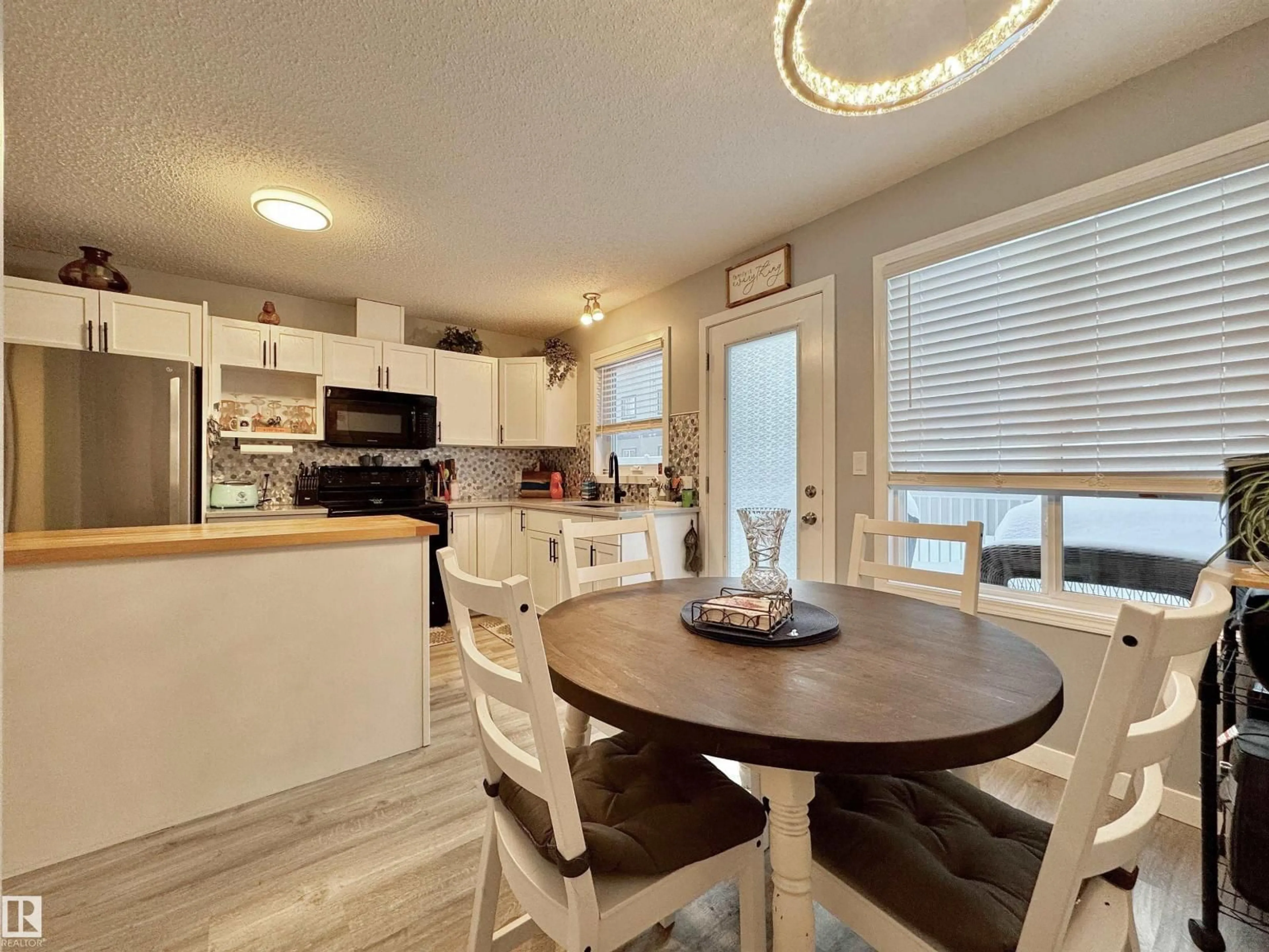Open concept kitchen, wood/laminate floor for #40 - 320 SPRUCERIDGE RD, Spruce Grove Alberta T7X0H5