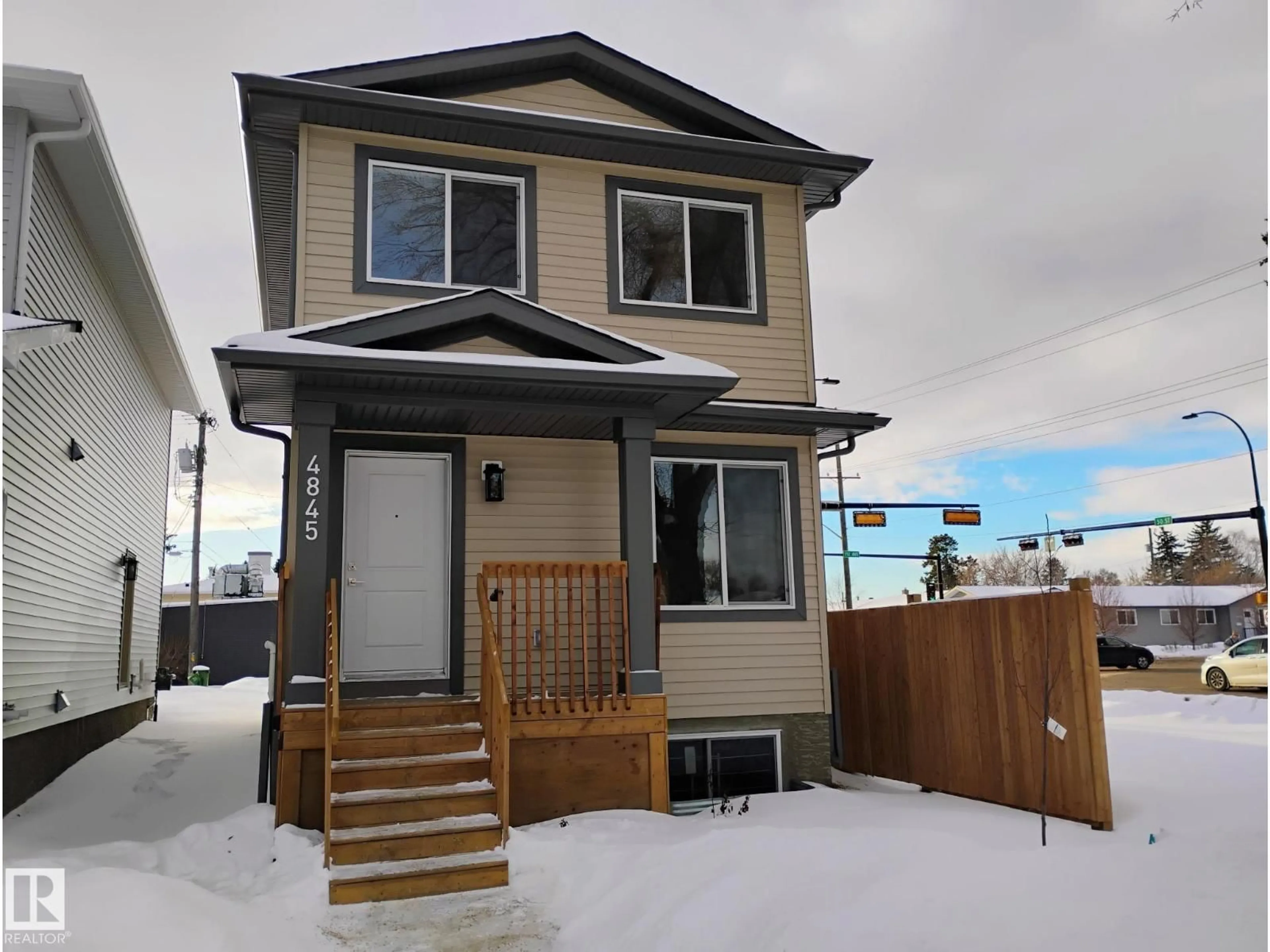 Home with vinyl exterior material, street for 4845 115 AV, Edmonton Alberta T5W0W3