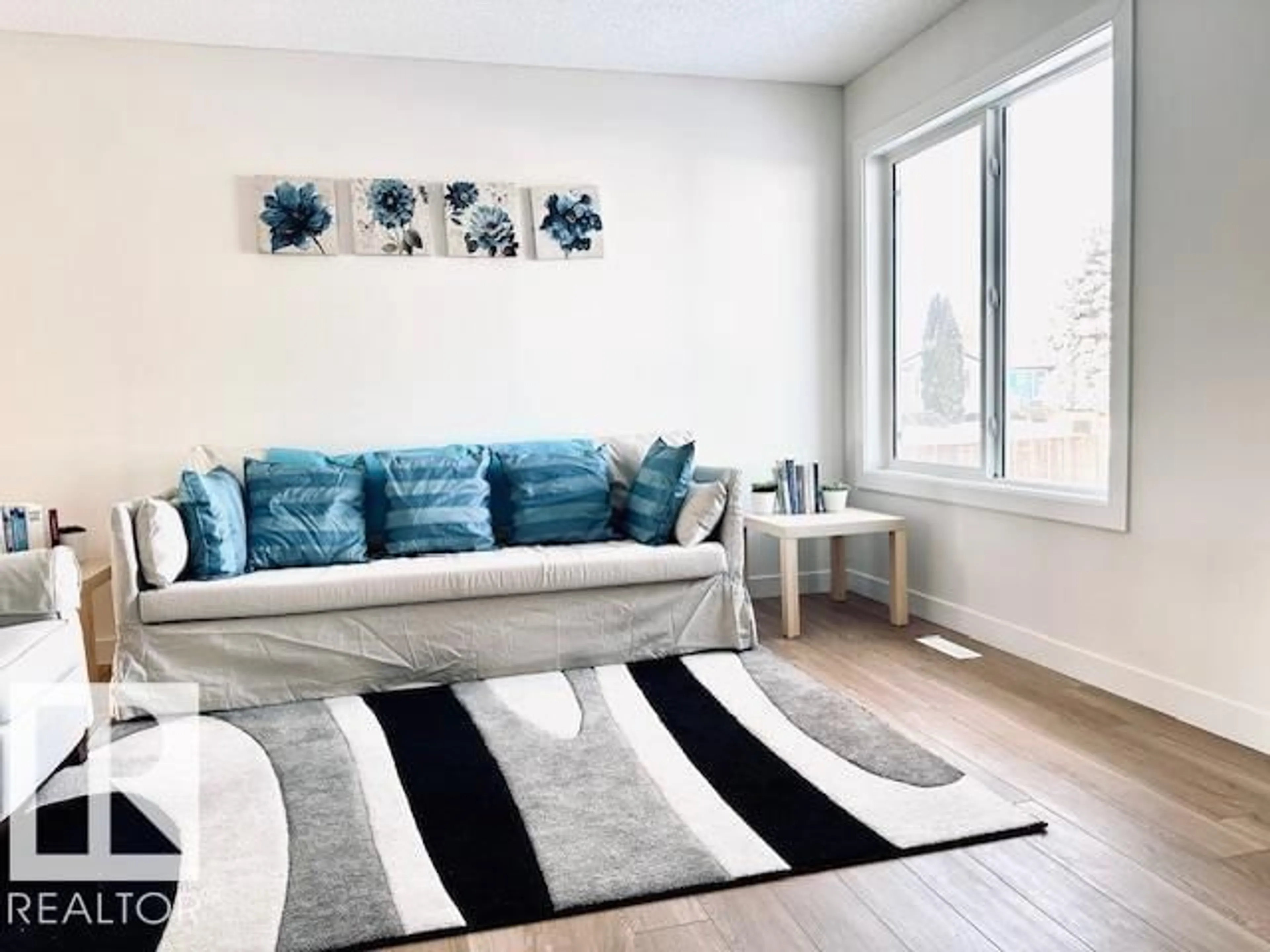 Living room with furniture, unknown for 4845 115 AV, Edmonton Alberta T5W0W3