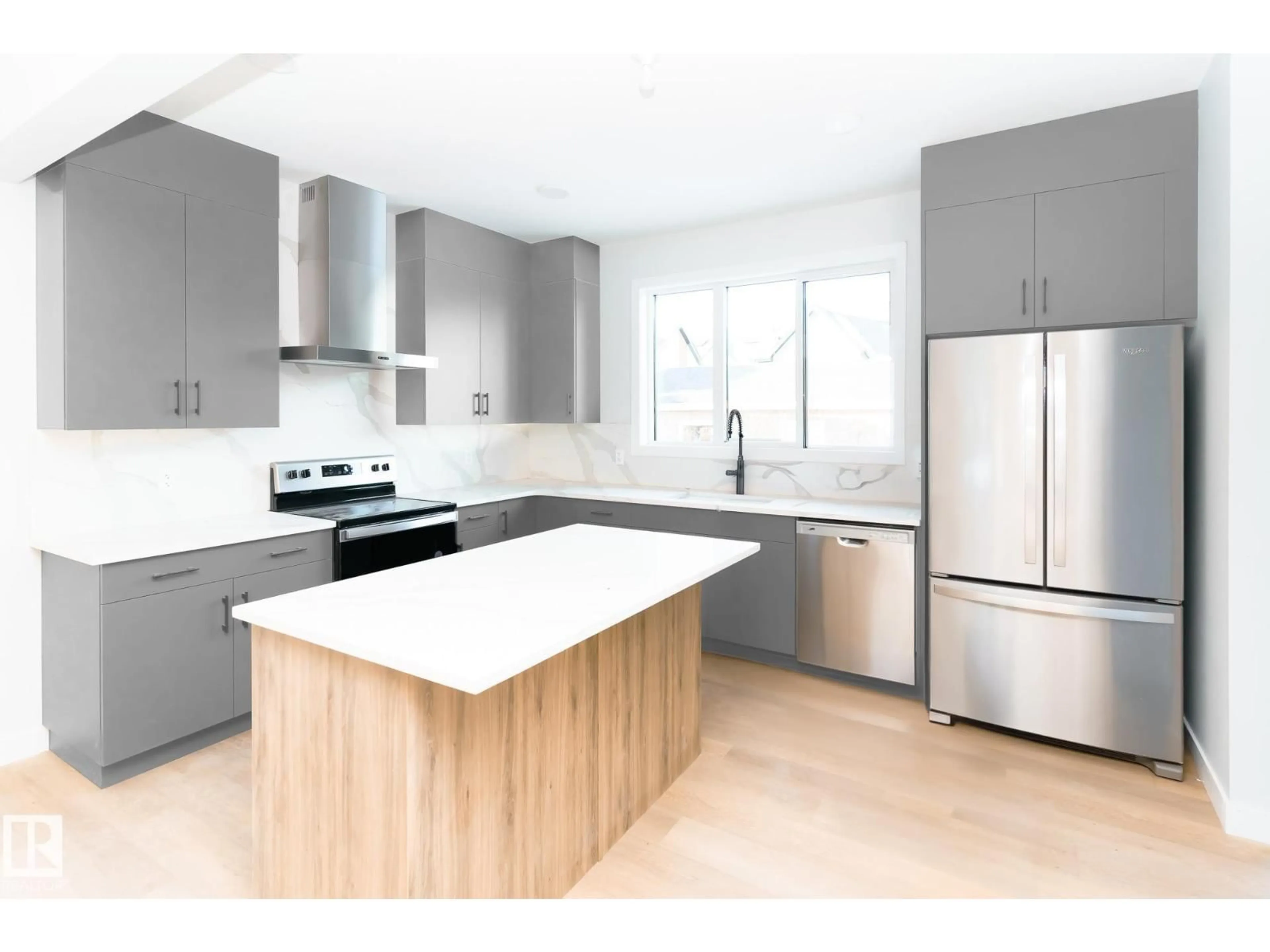 Open concept kitchen, wood/laminate floor for 5115 PILOT LN, Edmonton Alberta T5G2S5