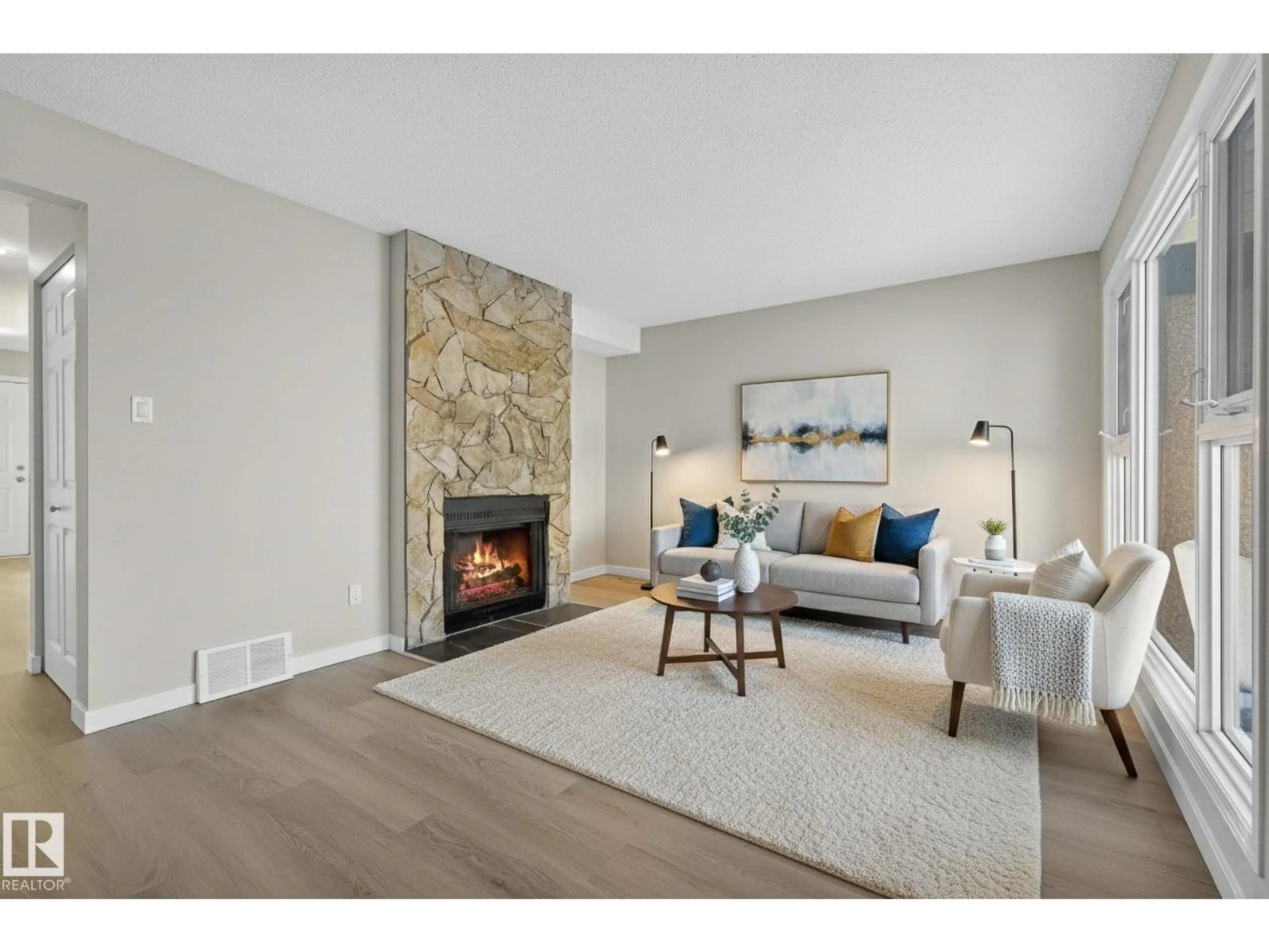 Living room with furniture, unknown for 3205 142 AV, Edmonton Alberta T5Y1H9