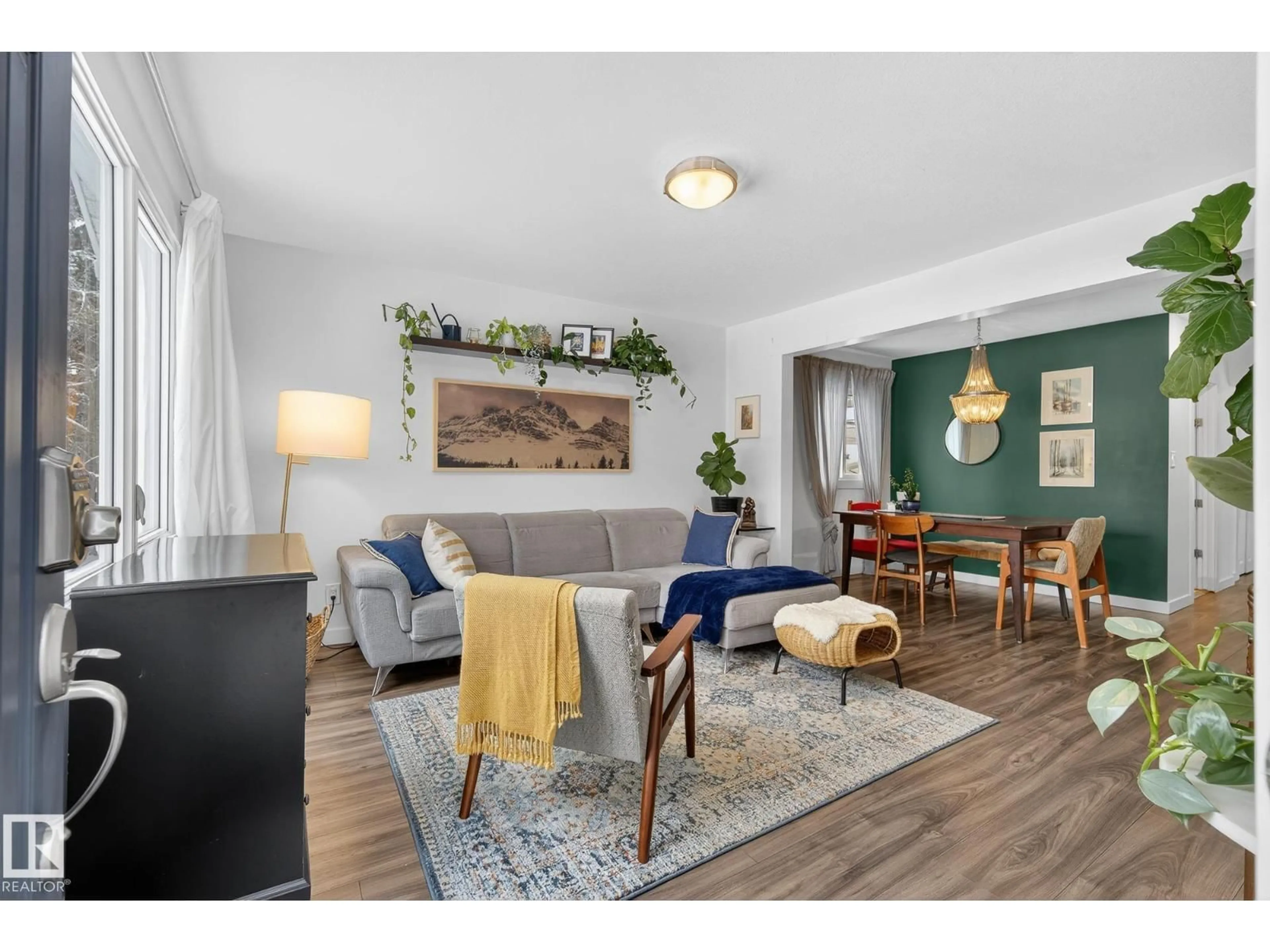 Living room with furniture, wood/laminate floor for 9022 92 ST, Edmonton Alberta T6C3R2