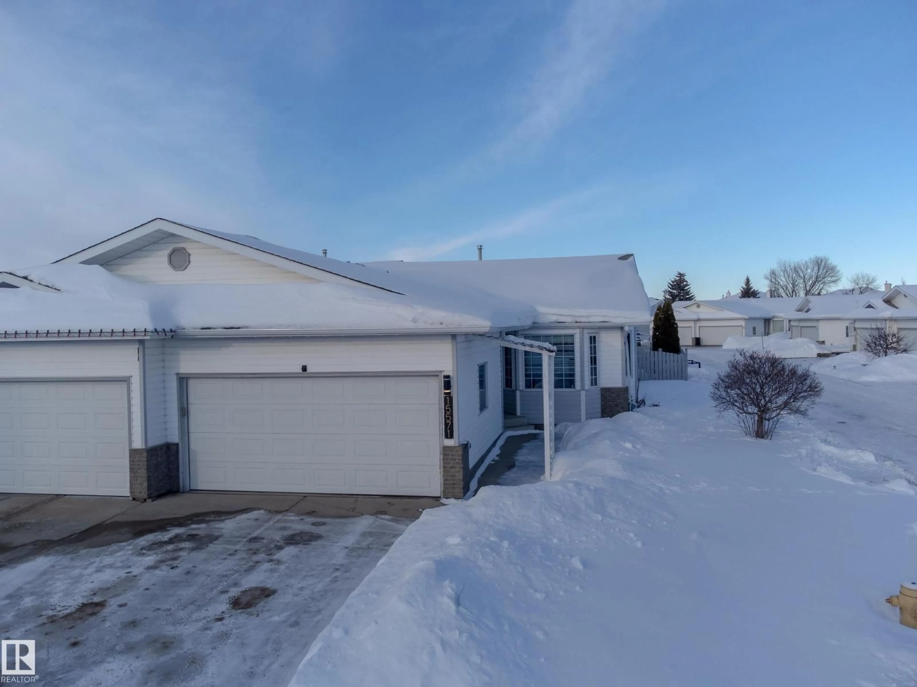 A pic from outside/outdoor area/front of a property/back of a property/a pic from drone, street for 15571 59A ST, Edmonton Alberta T5Y2N9