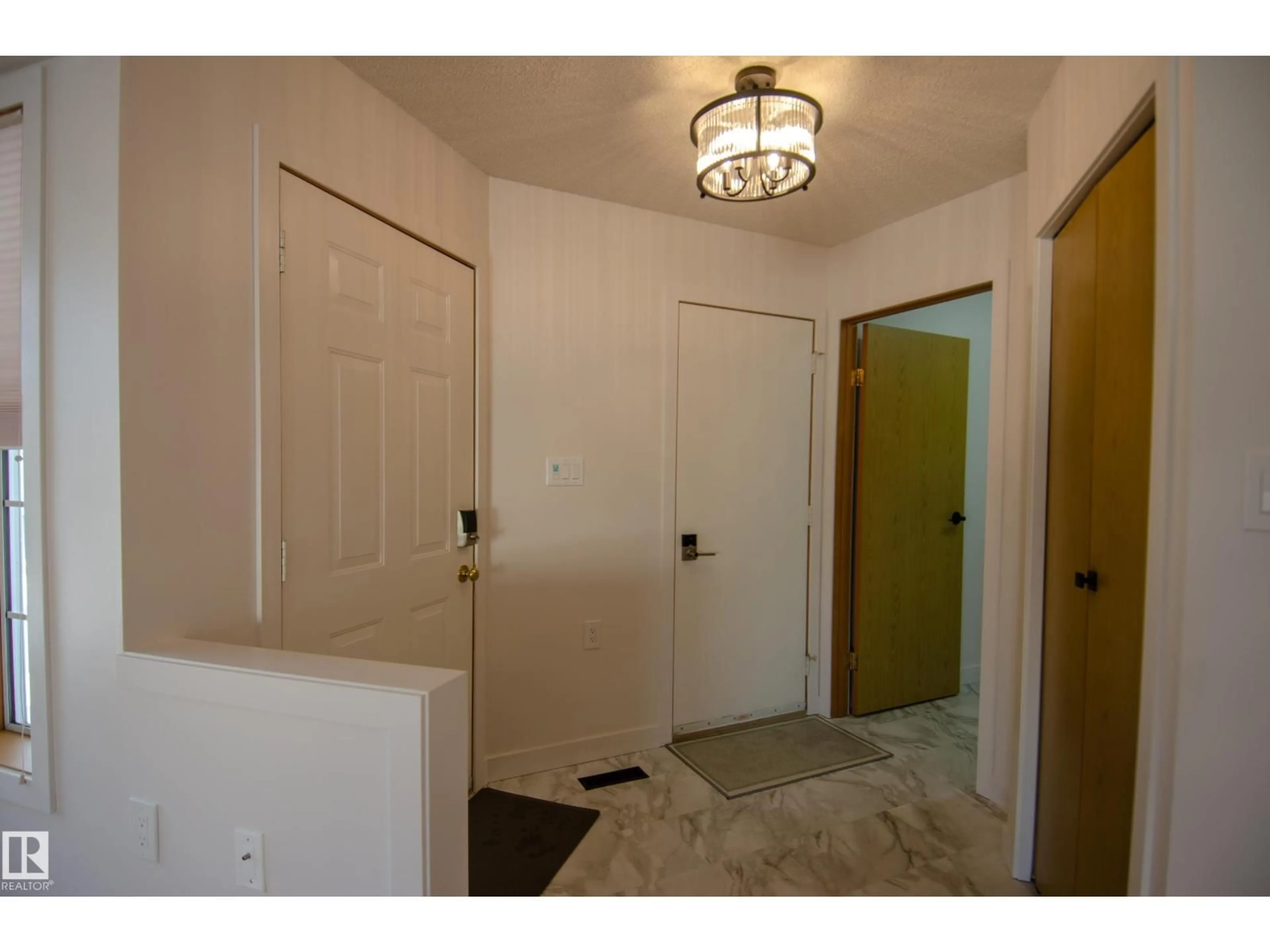 Indoor entryway for 15571 59A ST, Edmonton Alberta T5Y2N9