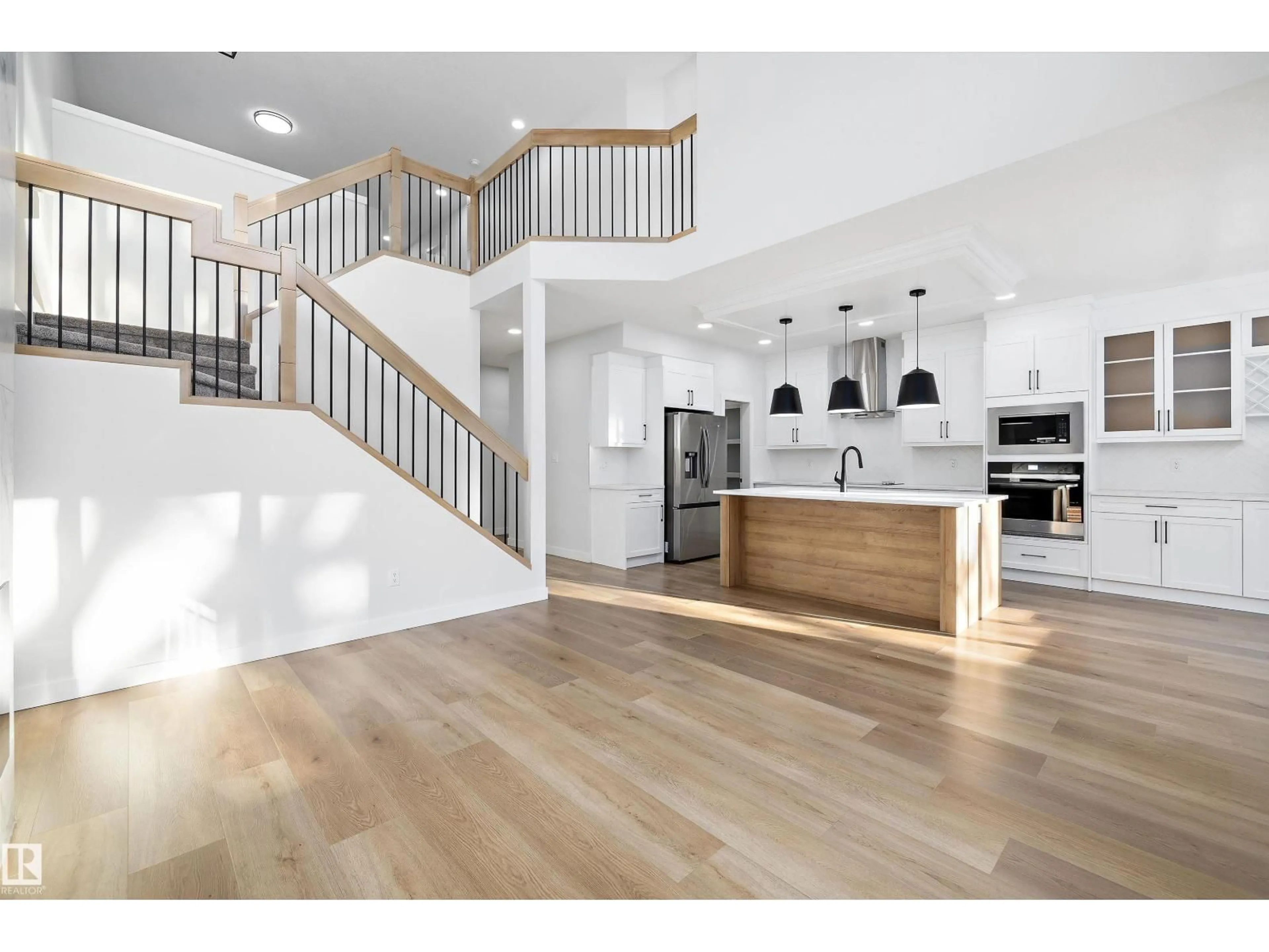 Open concept kitchen, wood/laminate floor for 1713 CROSSBILL LO, Edmonton Alberta T5S0W3