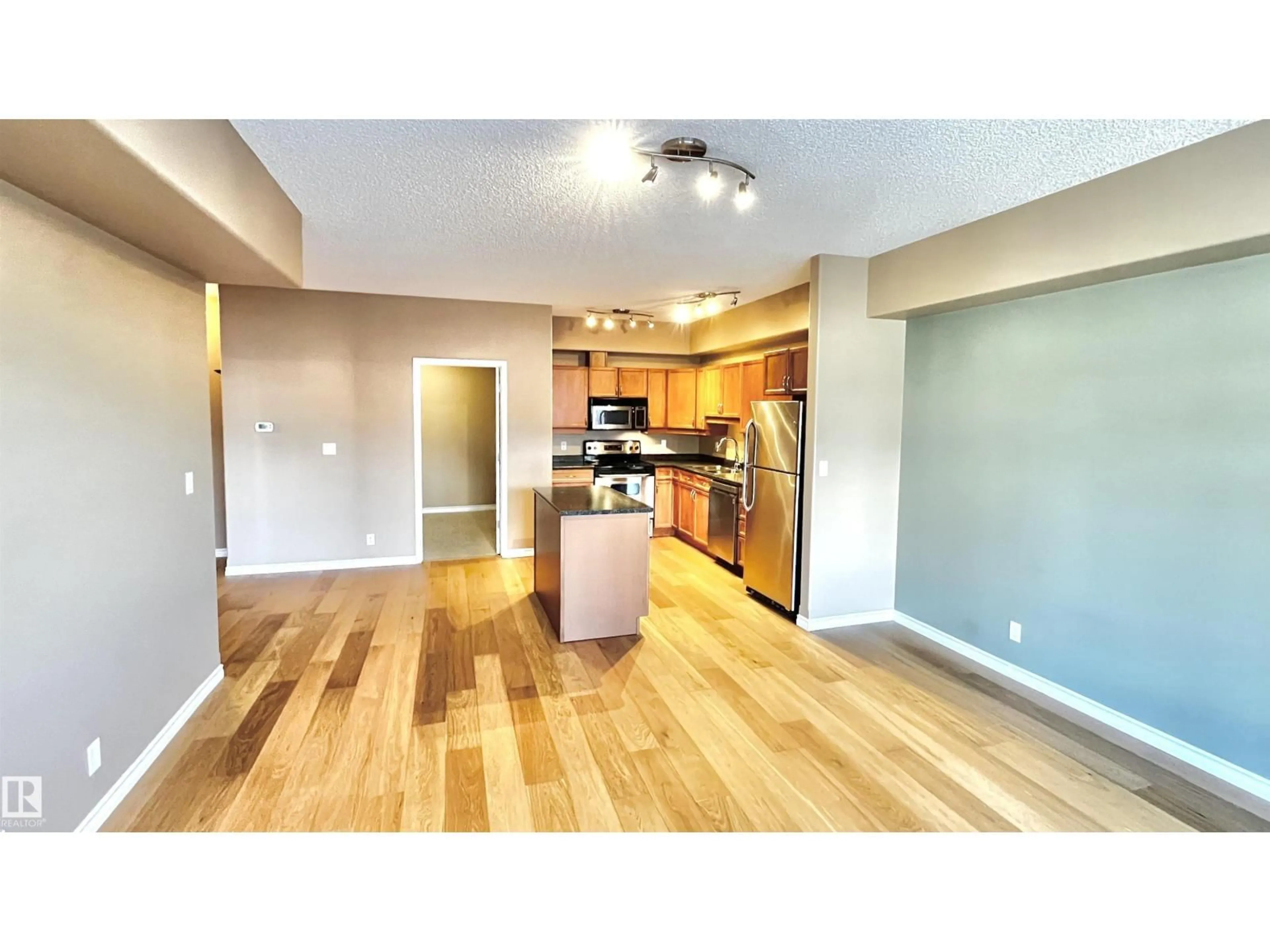 Open concept kitchen, wood/laminate floor for 405 - 10319 111 ST NW, Edmonton Alberta T5K0A2