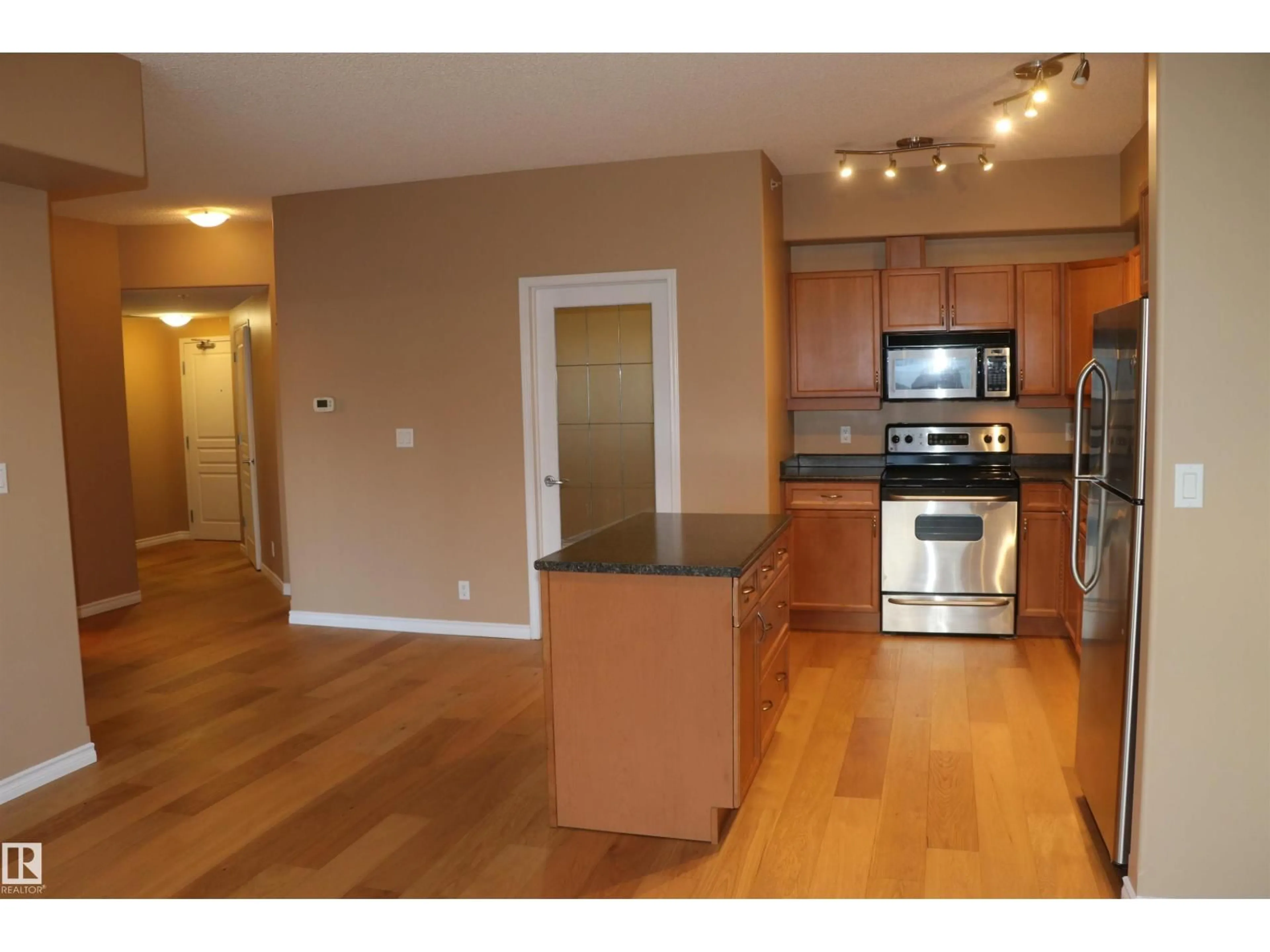 Open concept kitchen, wood/laminate floor for 405 - 10319 111 ST NW, Edmonton Alberta T5K0A2
