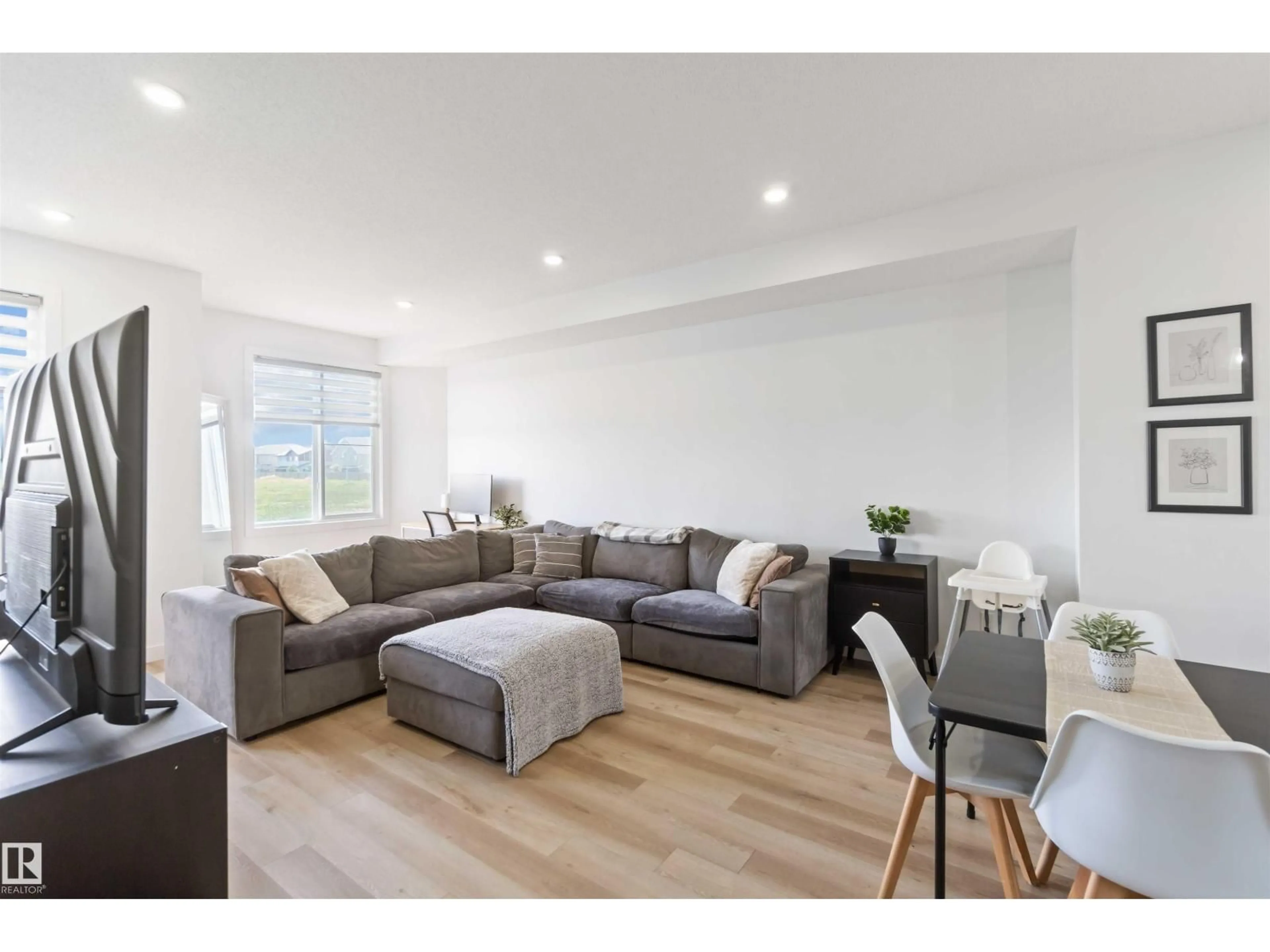 Living room with furniture, wood/laminate floor for 22778 97 AV, Edmonton Alberta T5T7S6