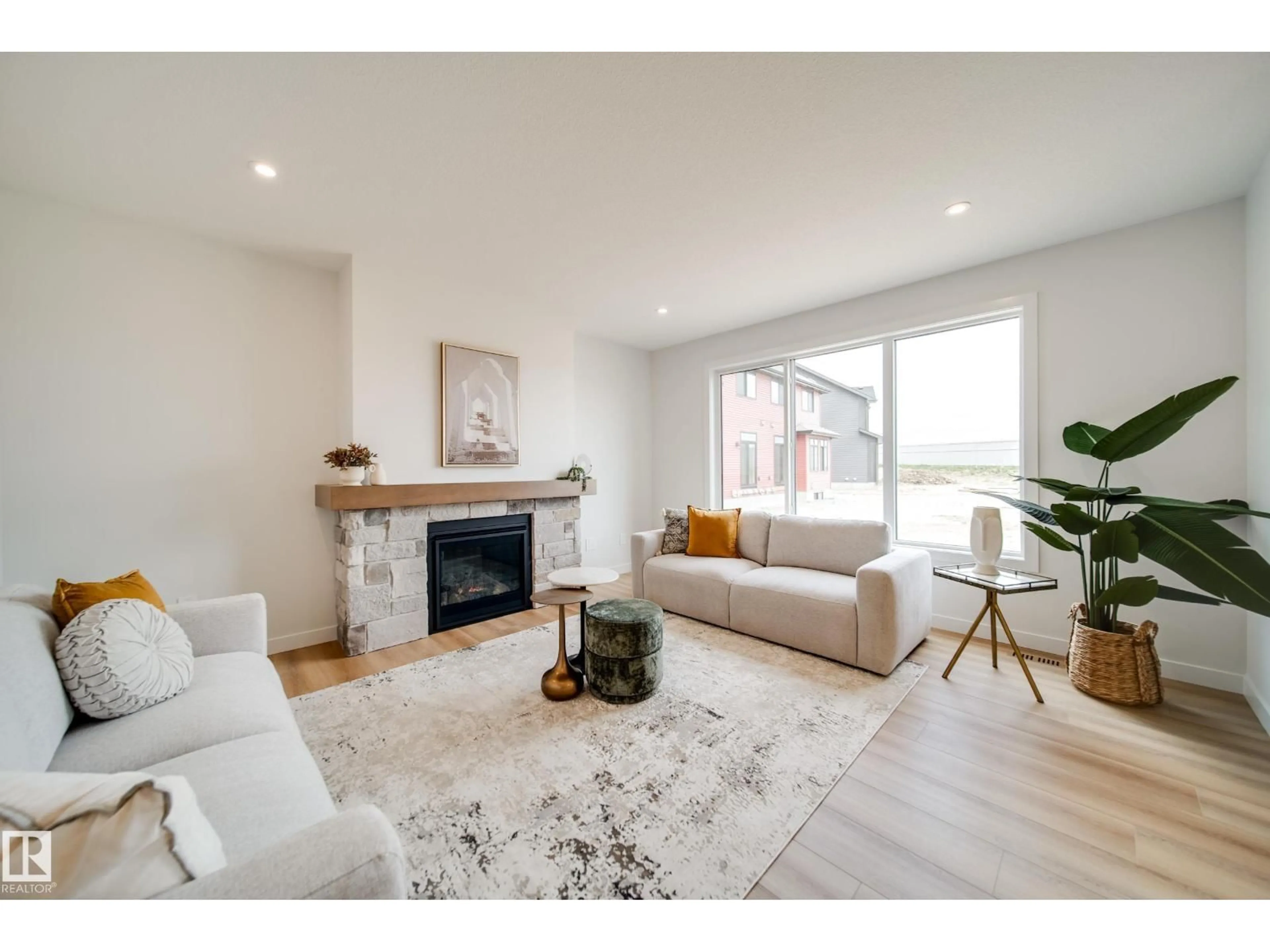 Living room with furniture, wood/laminate floor for 14 CLOUTIER CL, St. Albert Alberta T8T2C9